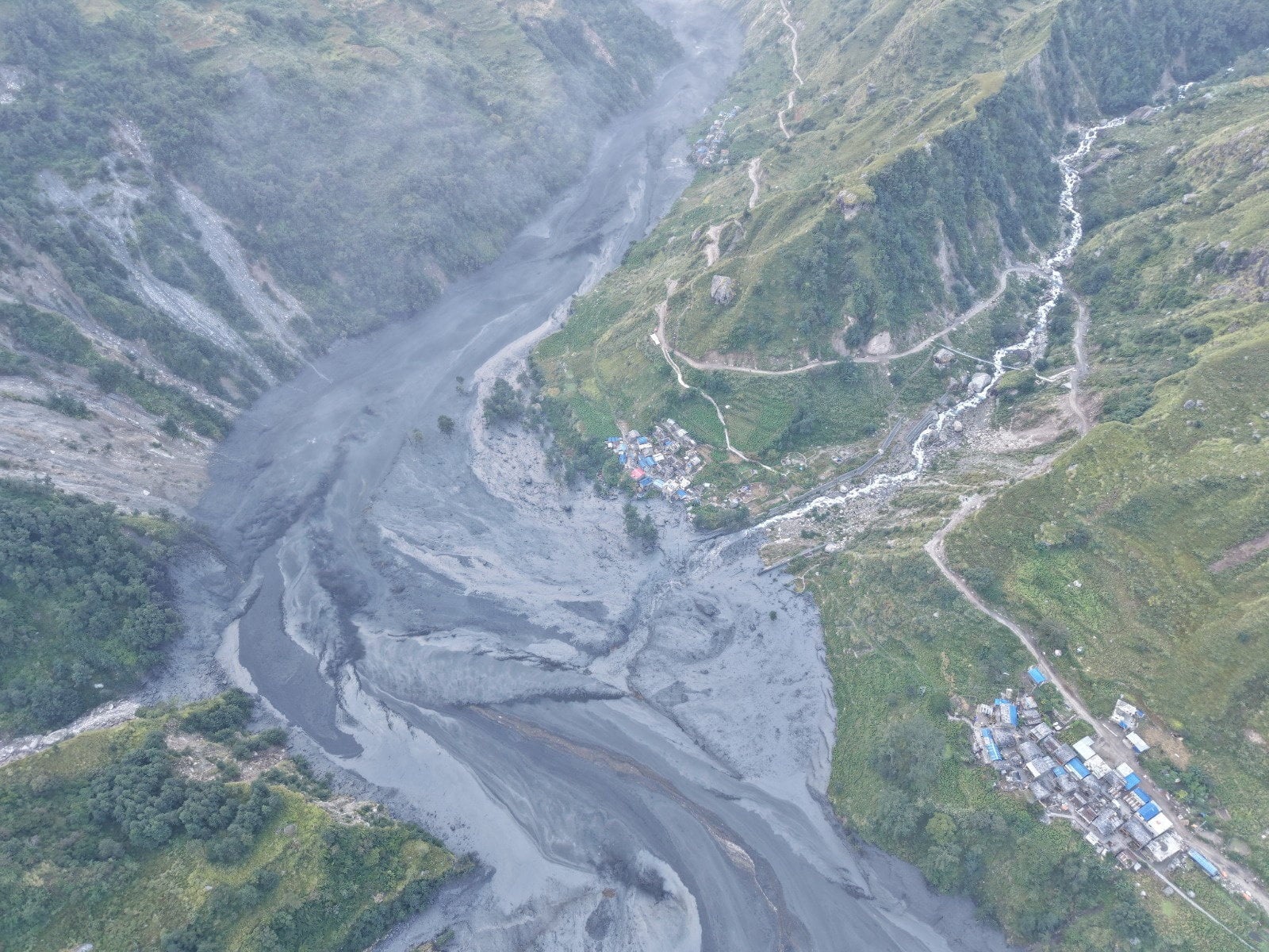 A drone view shows the areas affected by flooding of Budhi Gandaki River following a dry landslide in Chumnubri village, Gorkha district, Nepal, on Sunday. Photo: National Trust for Nature Conservation-Manaslu Conservation Area Project via Reuters