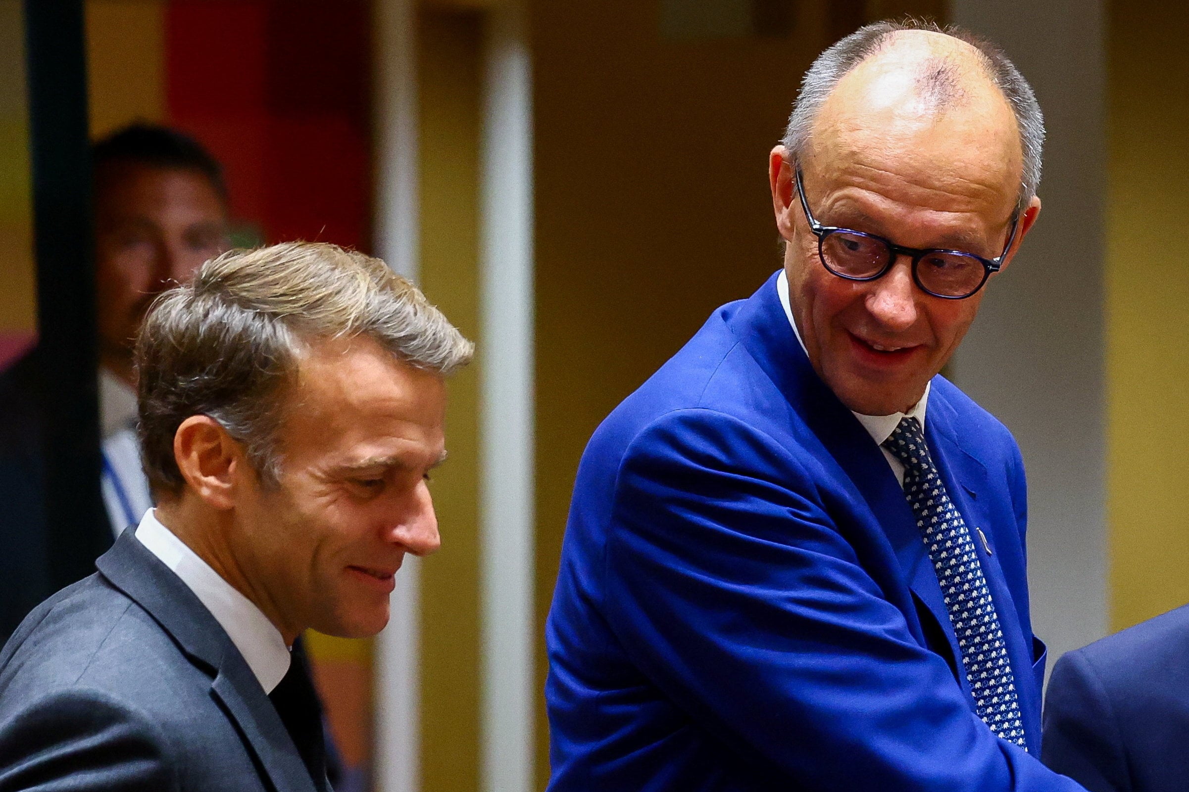 French President Emmanuel Macron (left) and German Chancellor Friedrich Merz attend an EU summit in Brussels, Belgium, on Thursday. Photo: Reuters