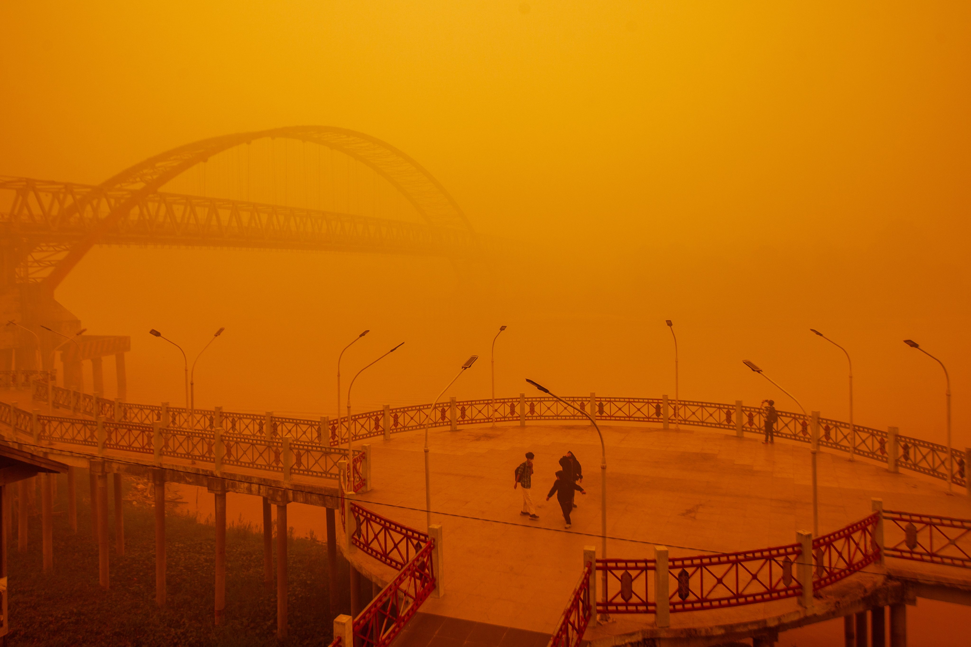 People walk through thick haze from wildfires in Palangkaraya, Central Kalimantan, Indonesia, on Wednesday. Photo: EPA