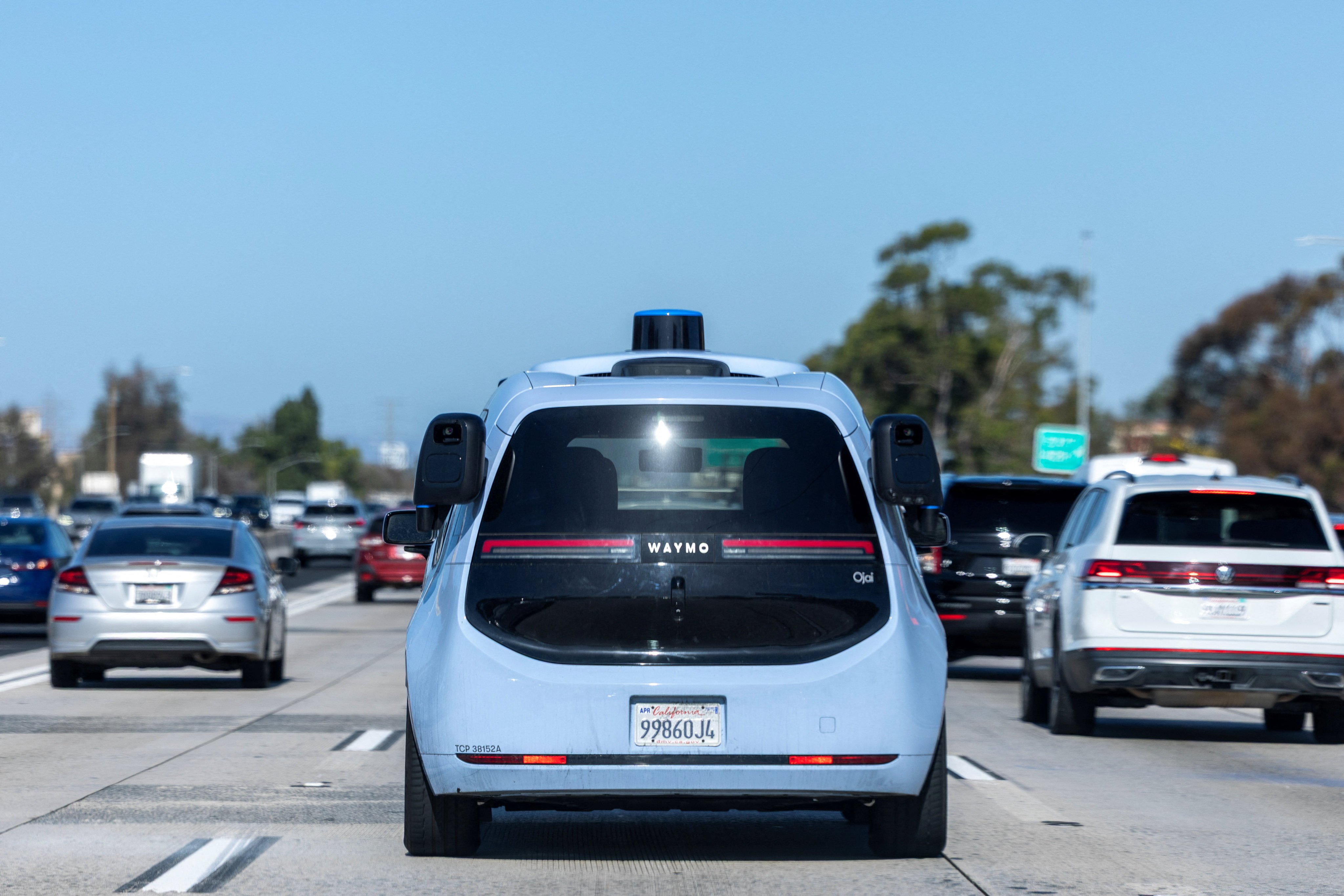 A Chinese-made Waymo Ojai autonomous electric vehicle on a freeway in Los Angeles on Tuesday. Photo: Reuters