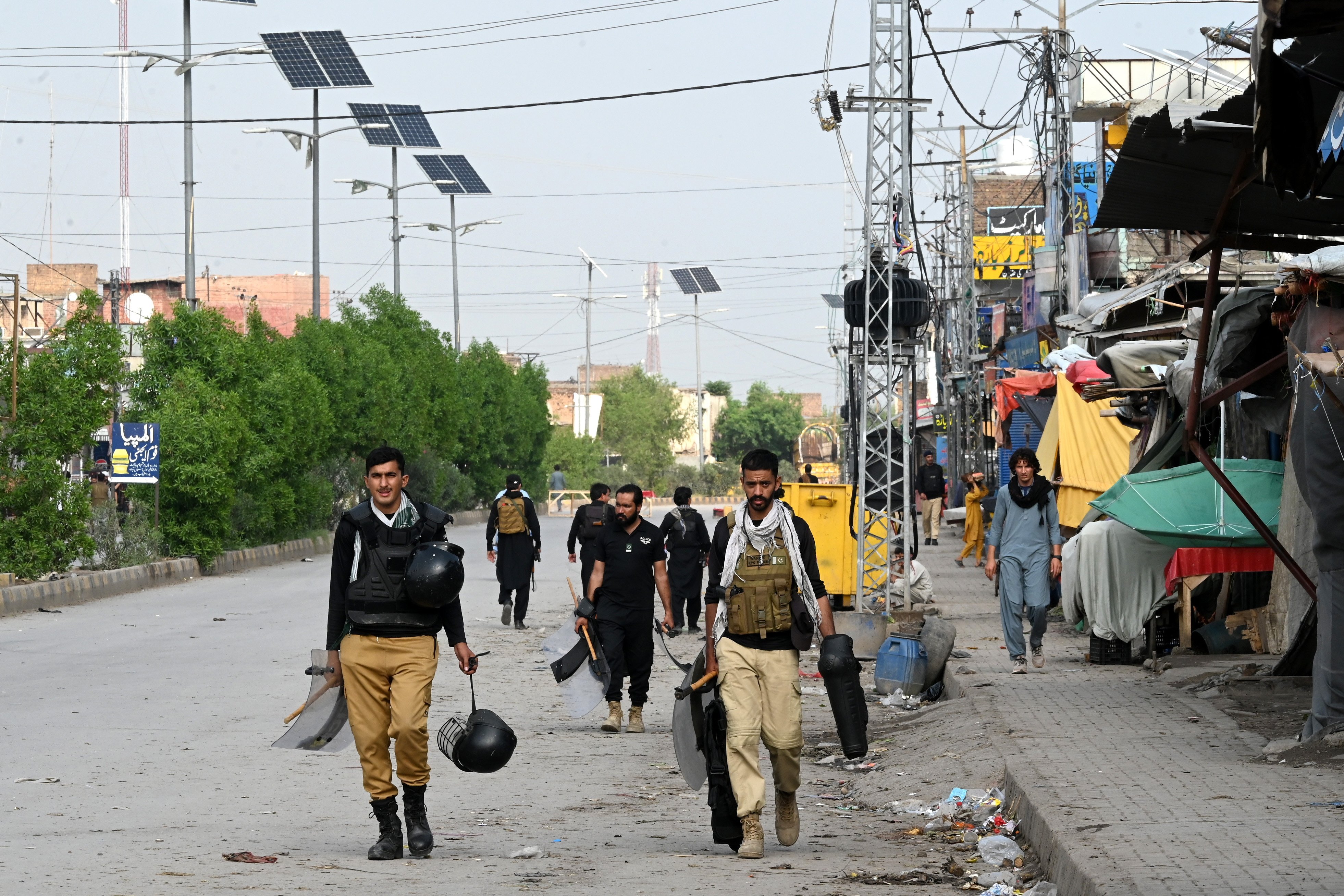 Security officials patrol a road in Bara, Khyber Pakhtunkhwa province, Pakistan, on Wednesday, a day after clashes with supporters of the PTI party. Photo: EPA