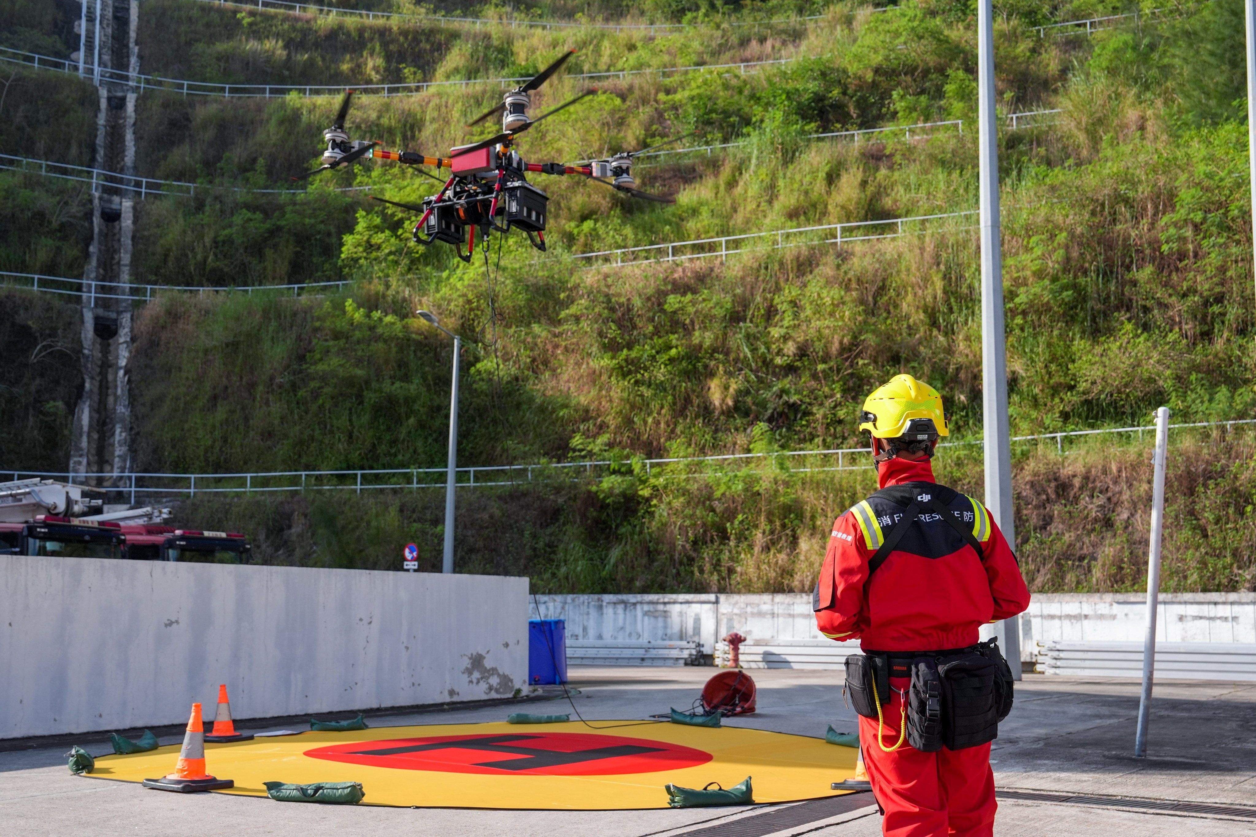 The Fire Services Department demonstrates a high-payload drone equipped with a water-bomb system. Photo: Elson Li