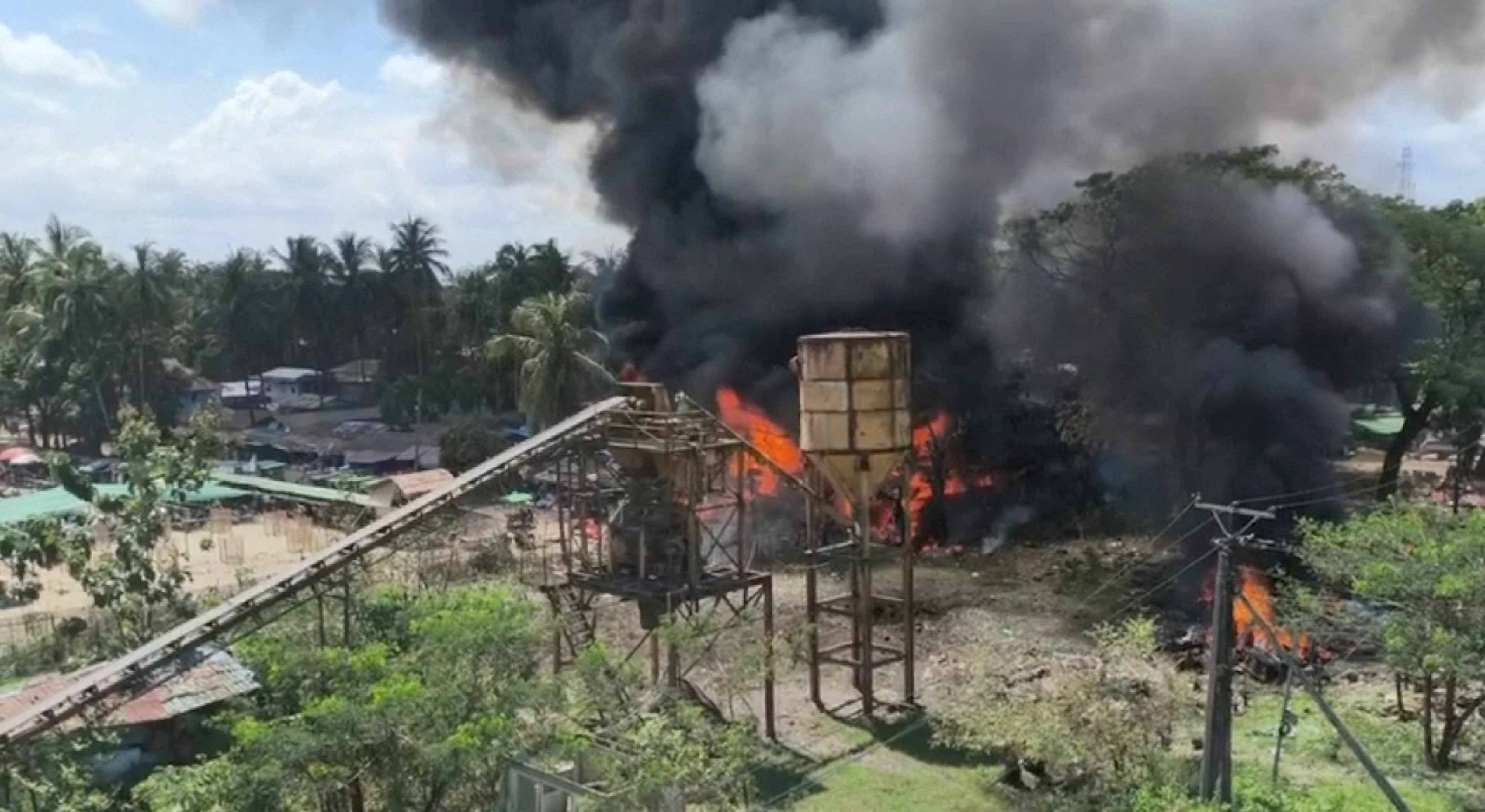 Smoke rises as fire burns following a Myanmar military air strike in Kyauktaw, Rakhine state, last month. Photo: Reuters