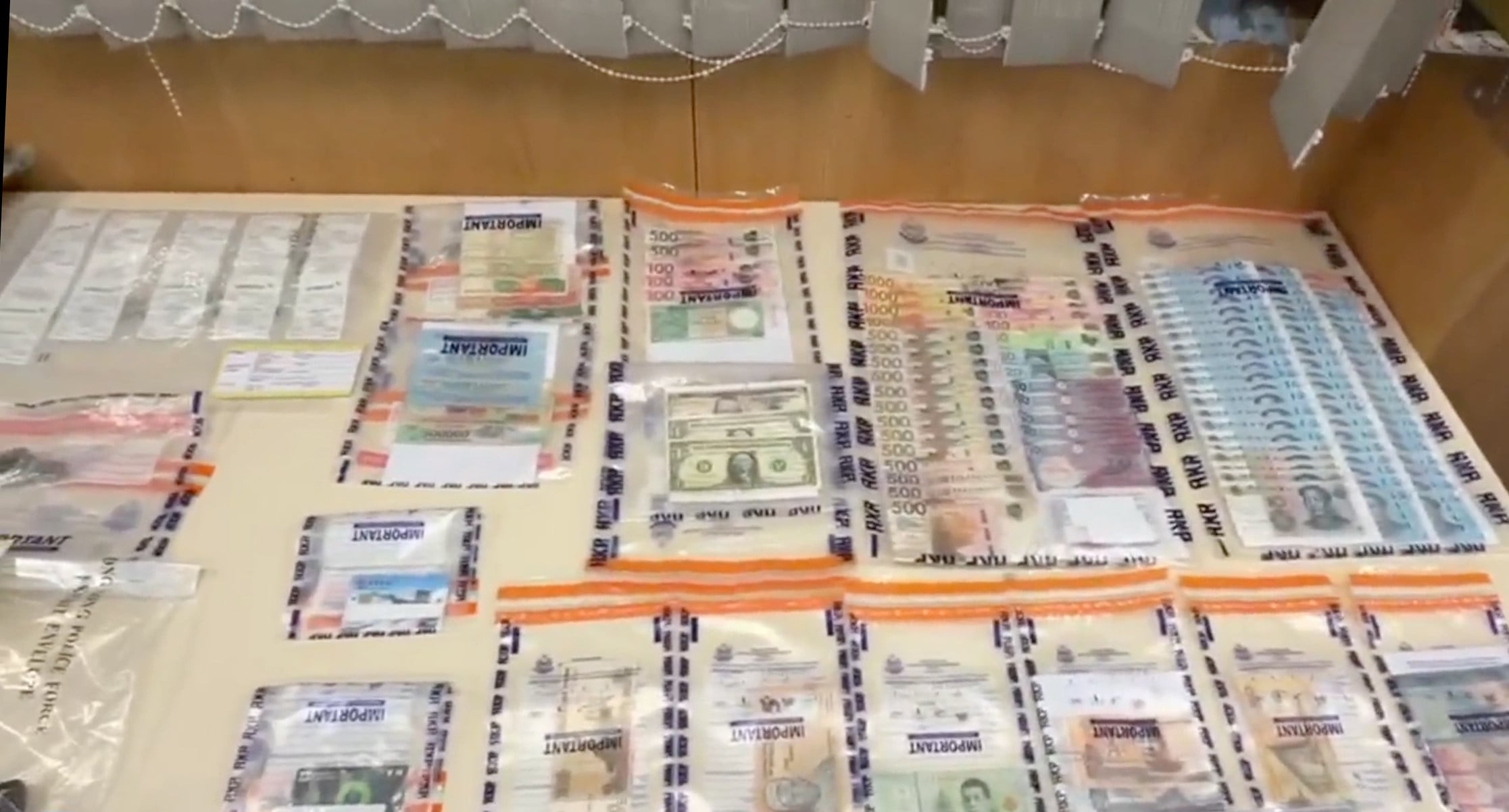 During Thursday’s operation, officers seized cash, credit cards and valuables, as well as clothes and shoes believed to belong to the suspects. Photo: Handout
