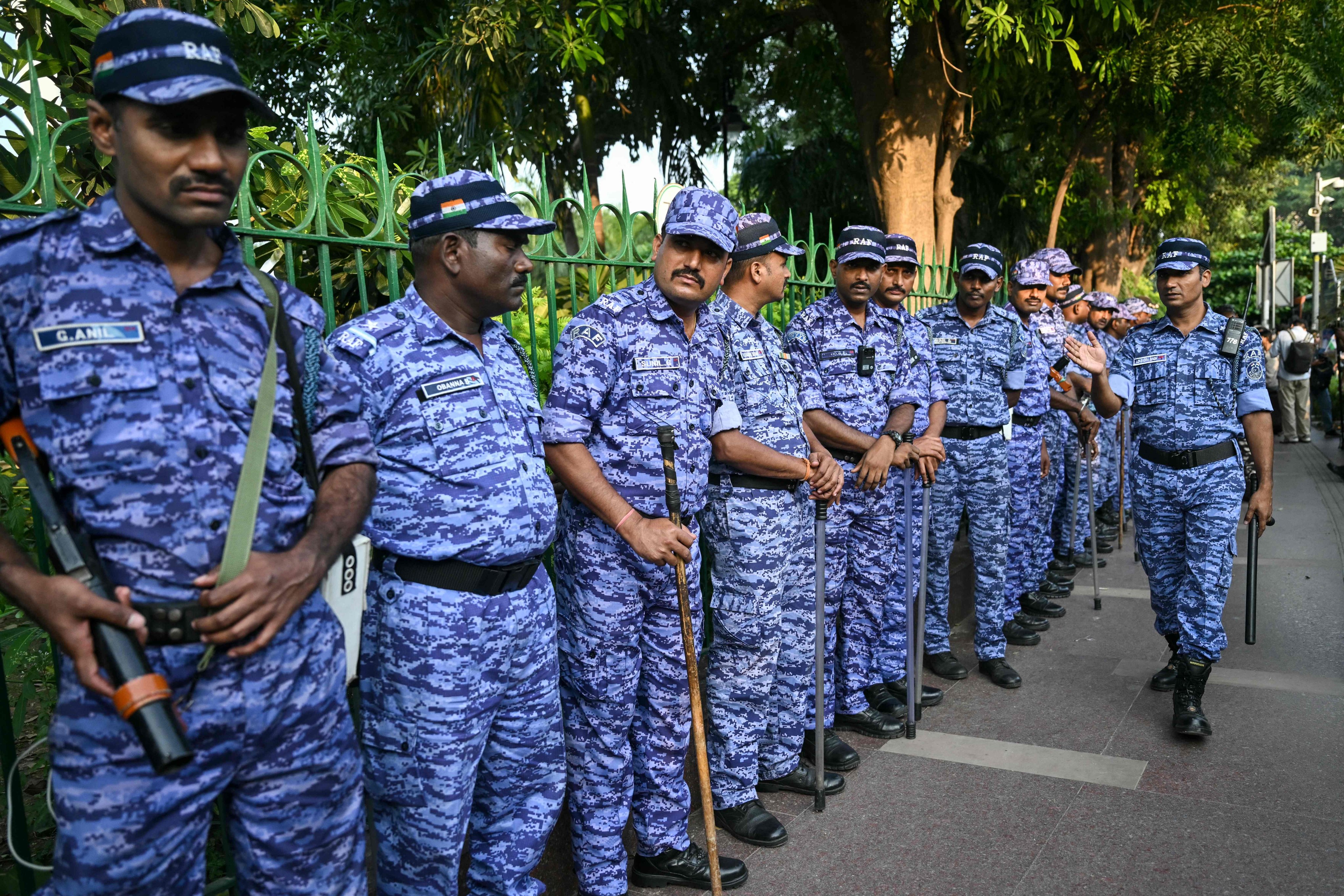 Security forces stand guard during a Cockroach Janta Party demonstration in New Delhi, India, on Friday. Photo: AFP