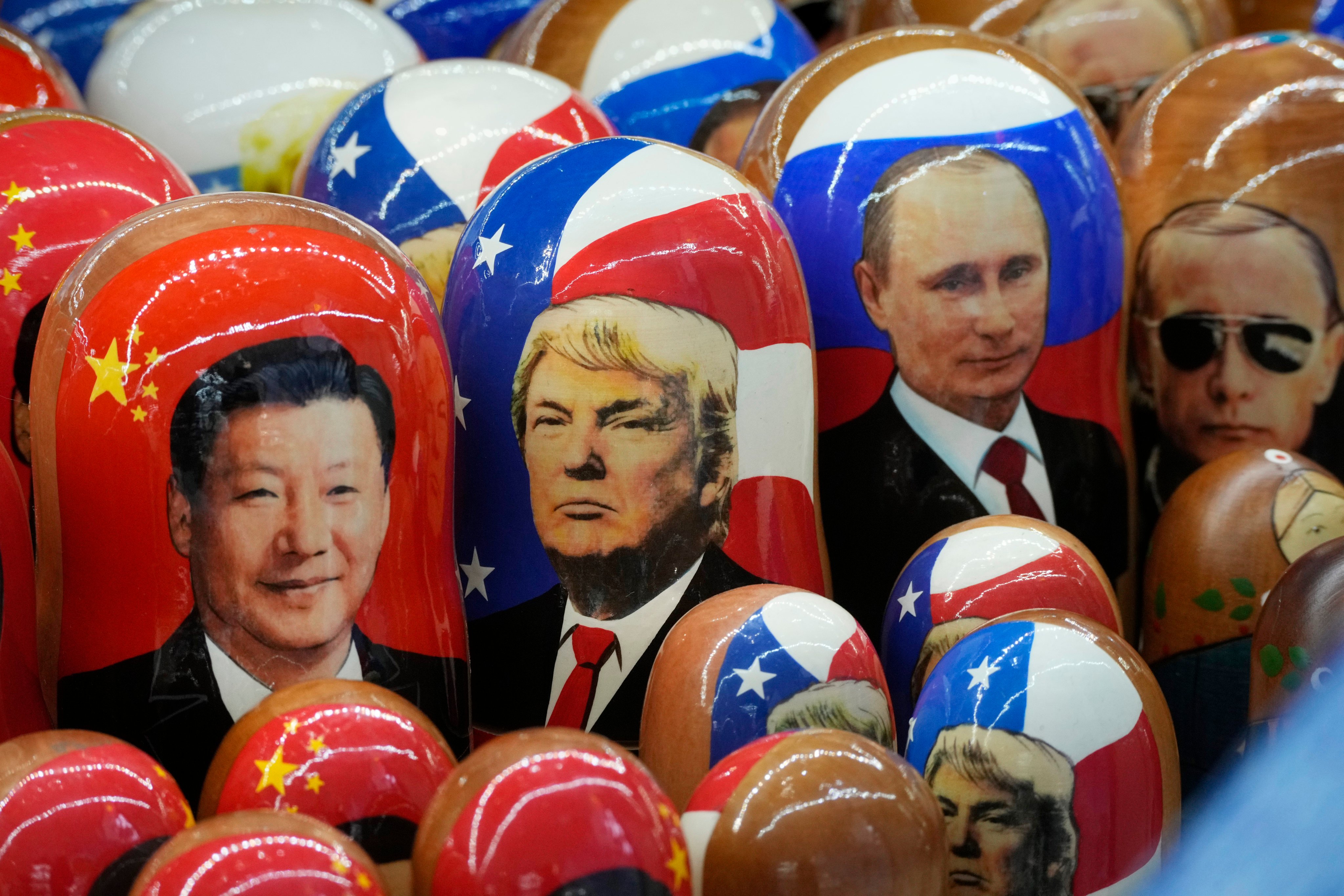 Traditional Russian wooden dolls depicting China’s President Xi Jinping, US President Donald Trump and Russian President Vladimir Putin are displayed for sale at a souvenir shop in St Petersburg, Russia, in November 2024. Photo: AP
