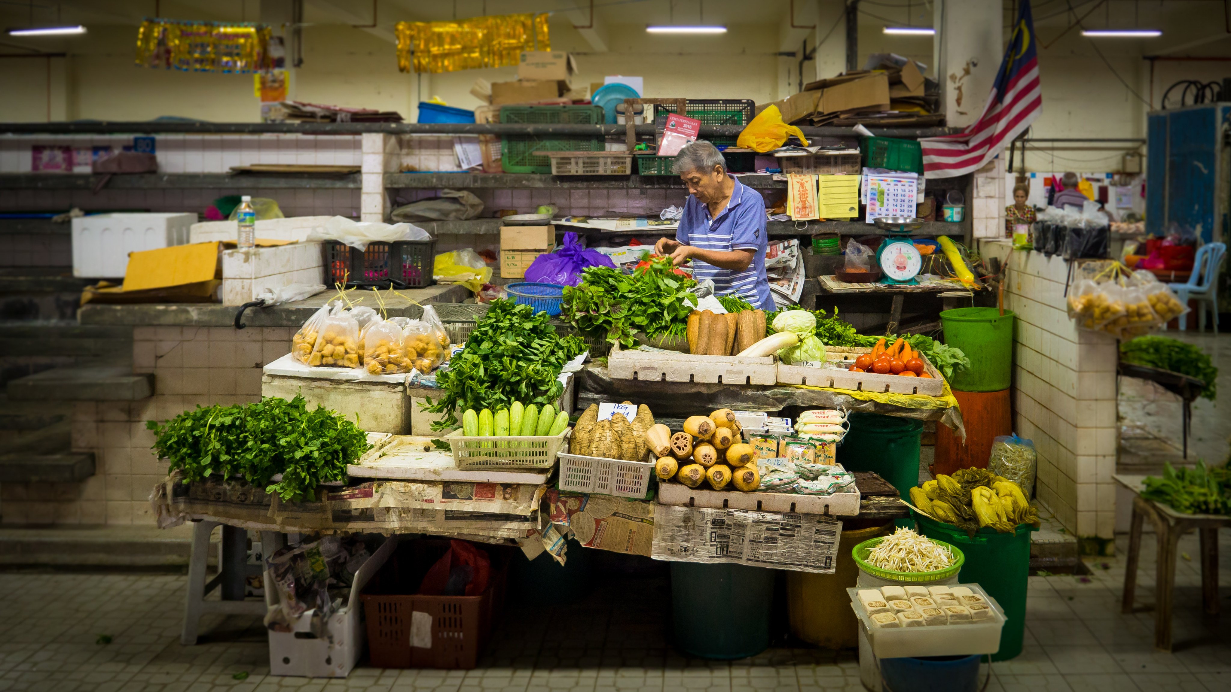 A vendor sells fruit and vegetables in Pasar Besar Bentong, a small town in the west side of Pahang Darul Makmur, Malaysia. Photo: Shutterstock