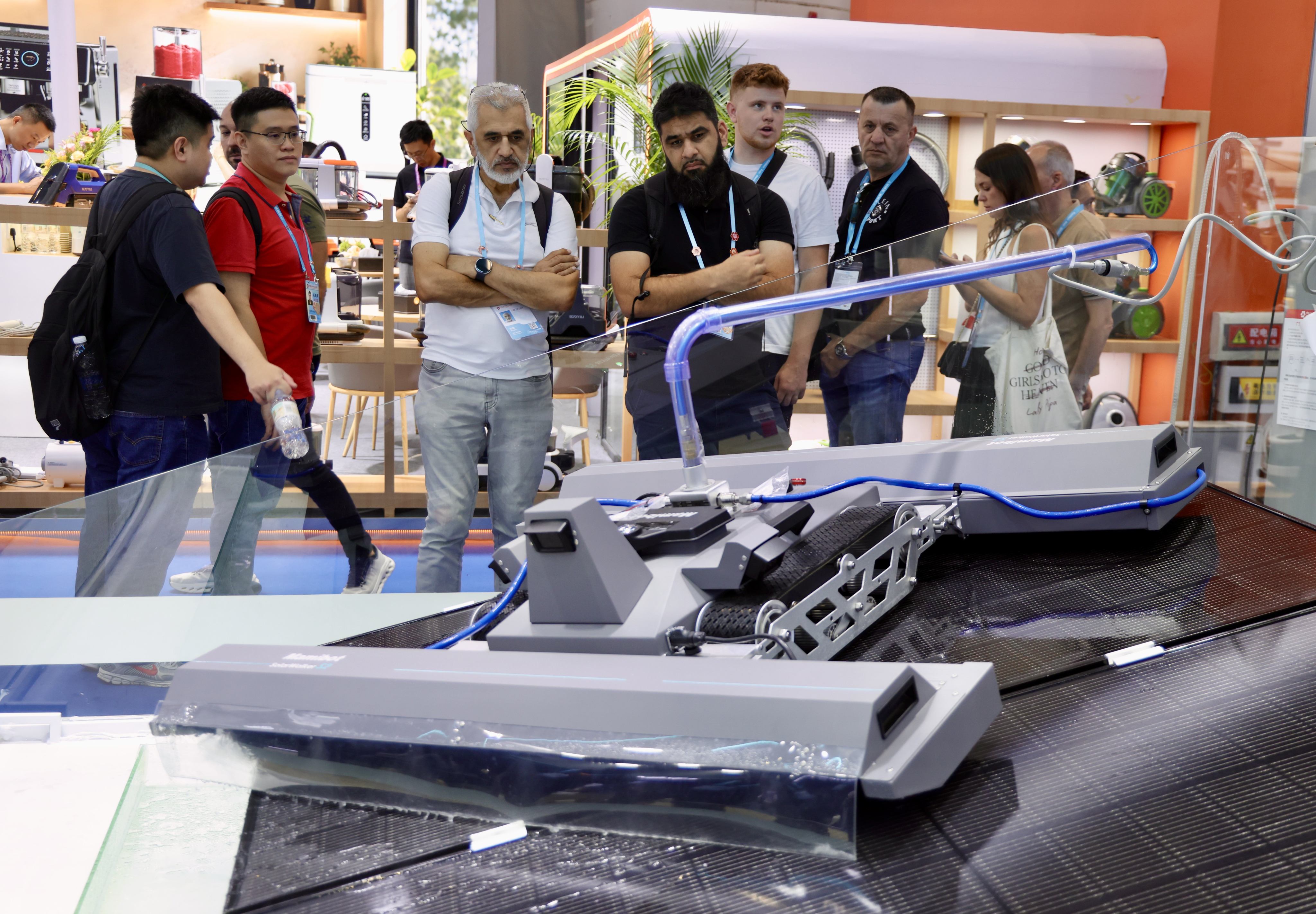 Overseas buyers view a solar panel cleaner during the Canton Fair in Guangzhou, in south China’s Guangdong province, on Thursday. Photo: Xinhua