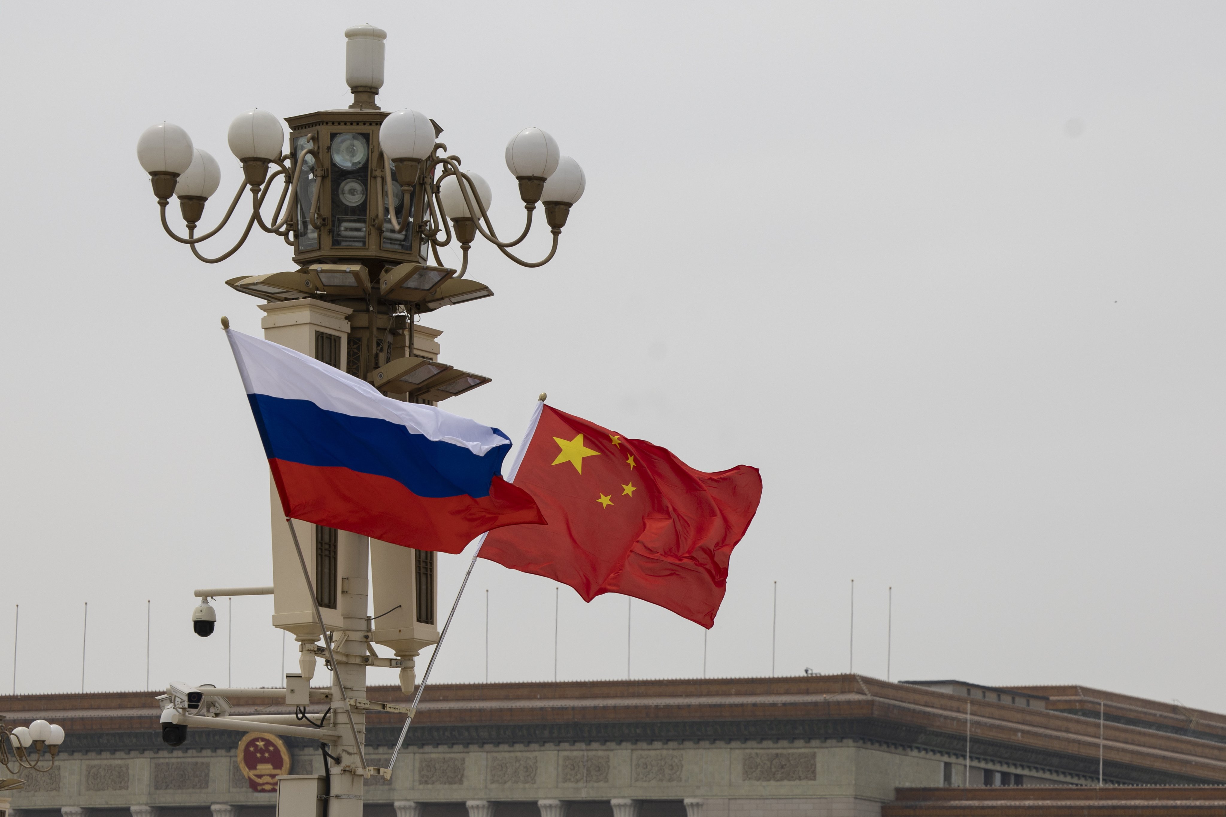 The flags of Russia and China fly in Tiananmen Square in Beijing. Photo: EPA-EFE