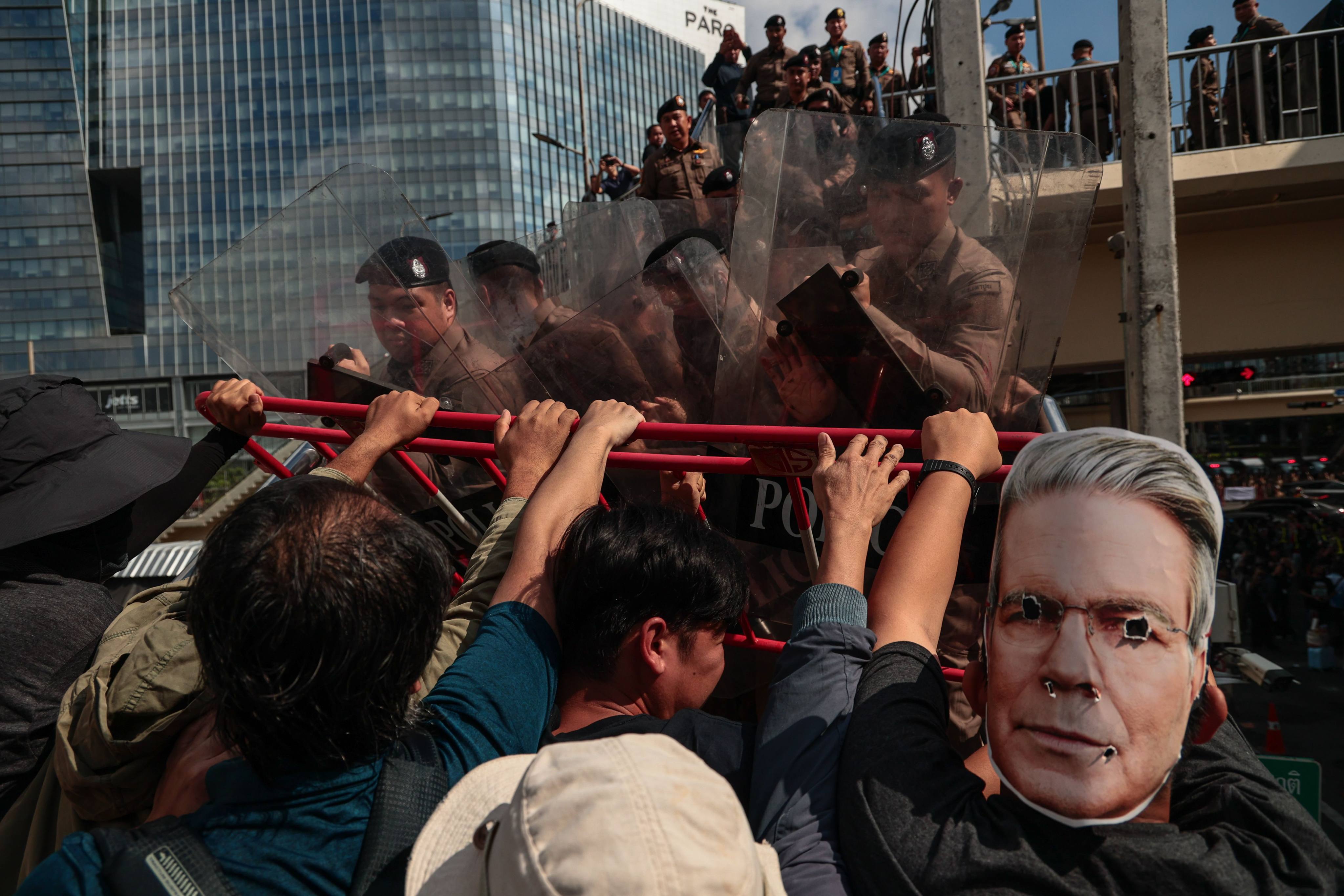 Protesters clash with police officers during a march against the IMF and World Bank in Bangkok on Thursday. Photo: dpa