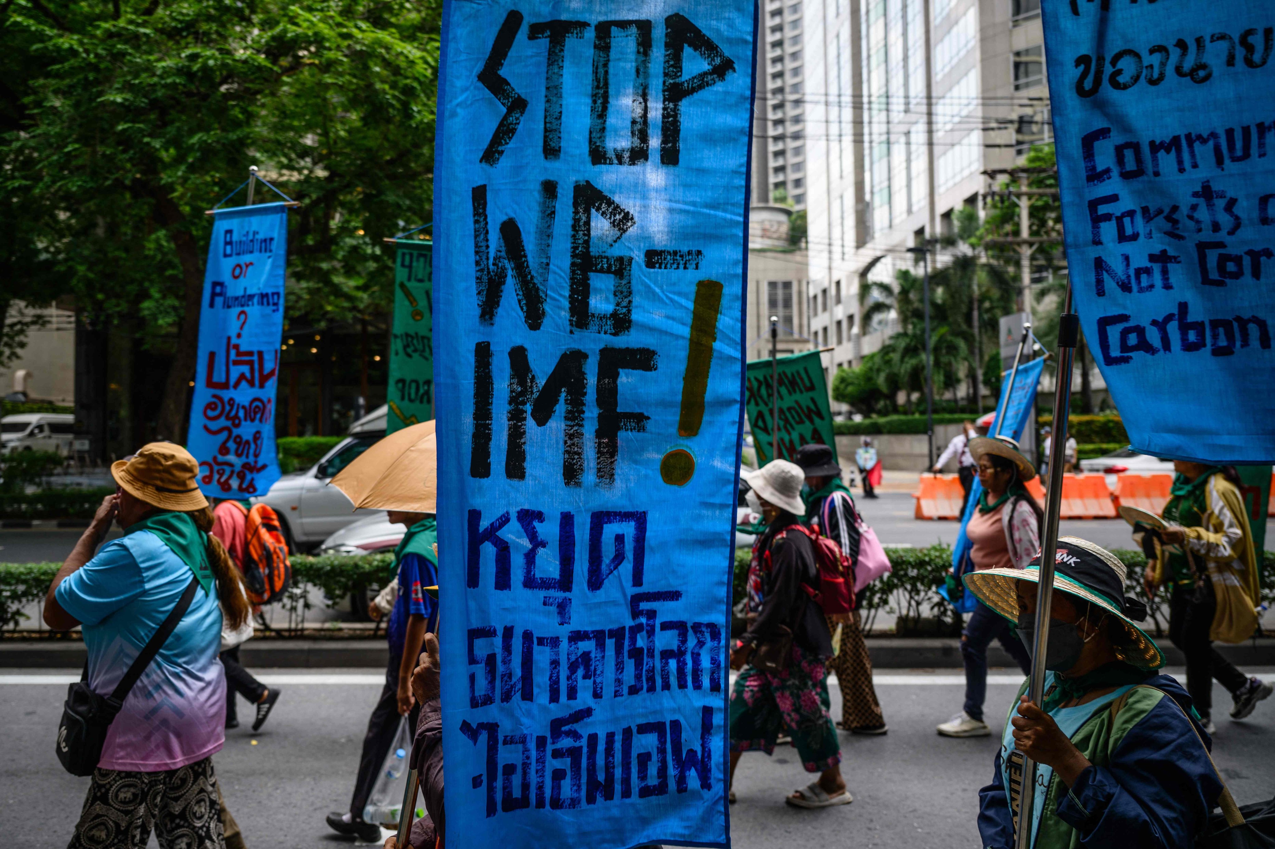 Demonstrators march during a protest against the IMF and World Bank in Bangkok on Friday. Photo: AFP