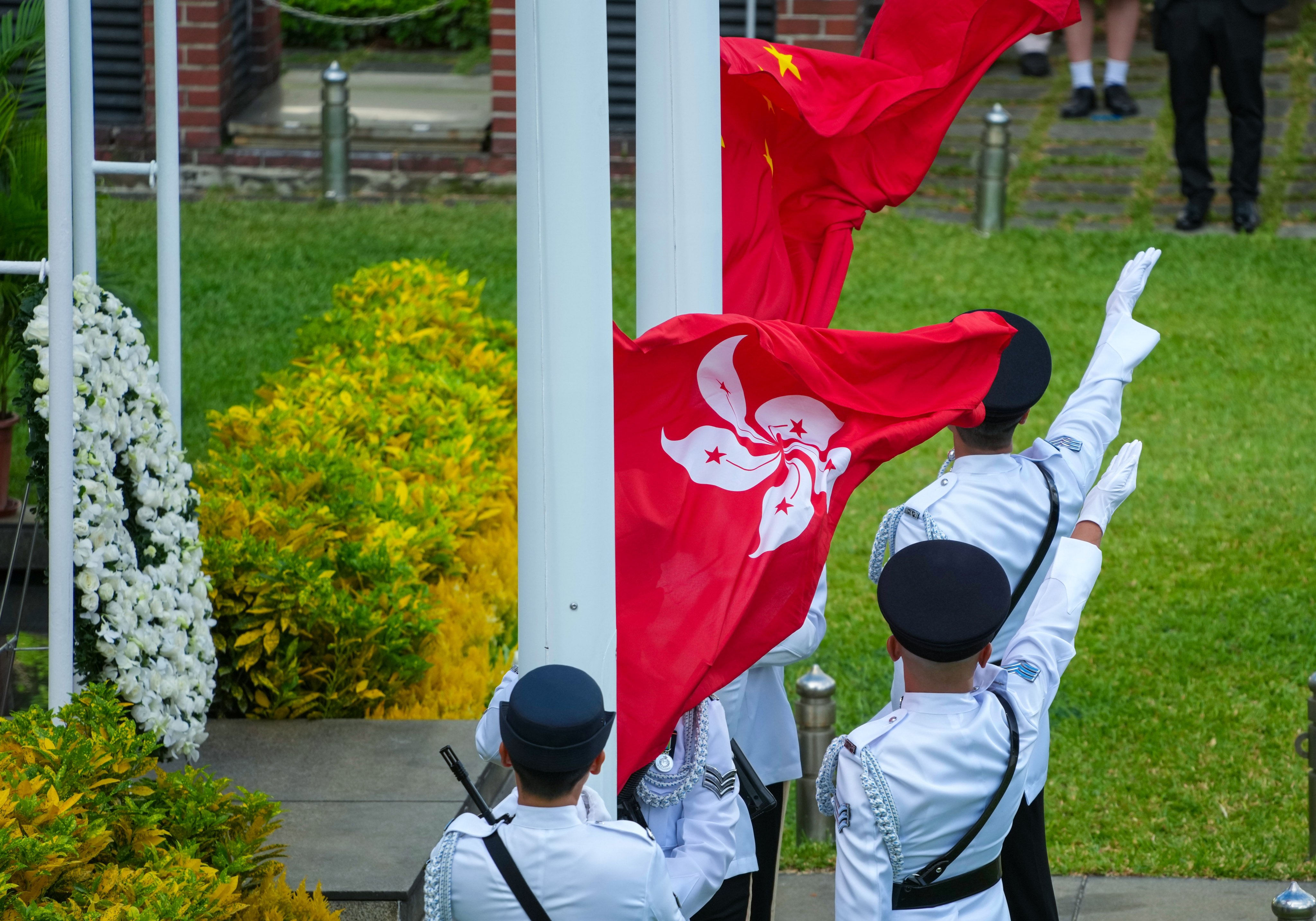 Flag-raising ceremony at the memorial event on Sunday. Photo: Karma Lo