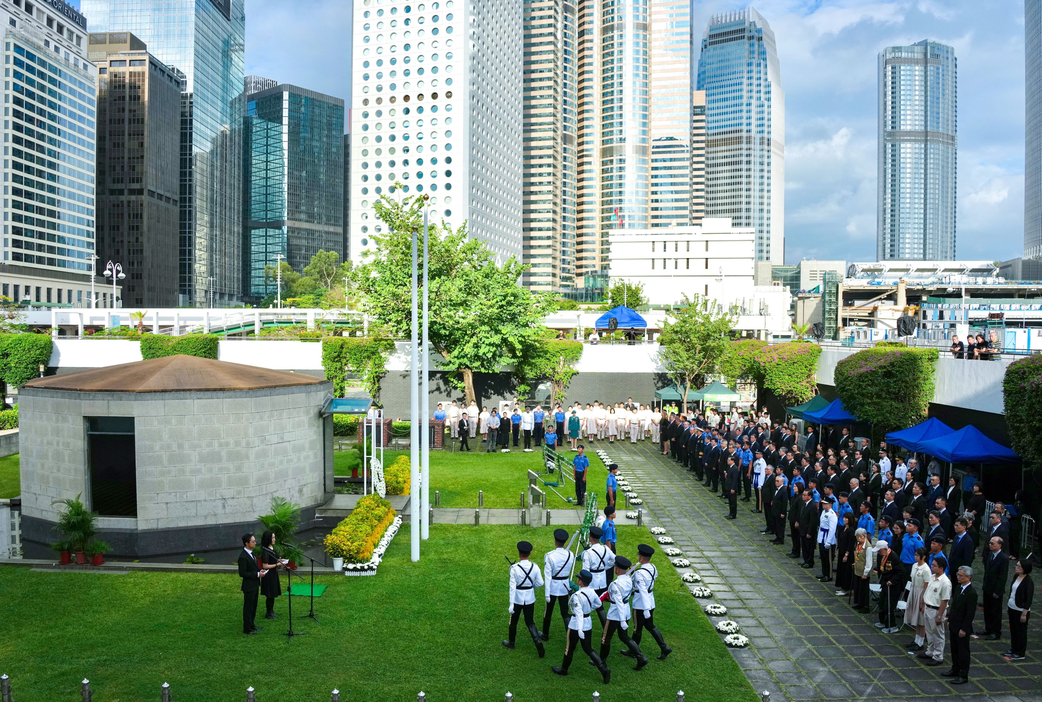 Hong Kong leaders pay tribute to the city’s wartime defenders at City Hall Memorial Garden in Central. Photo: Karma Lo