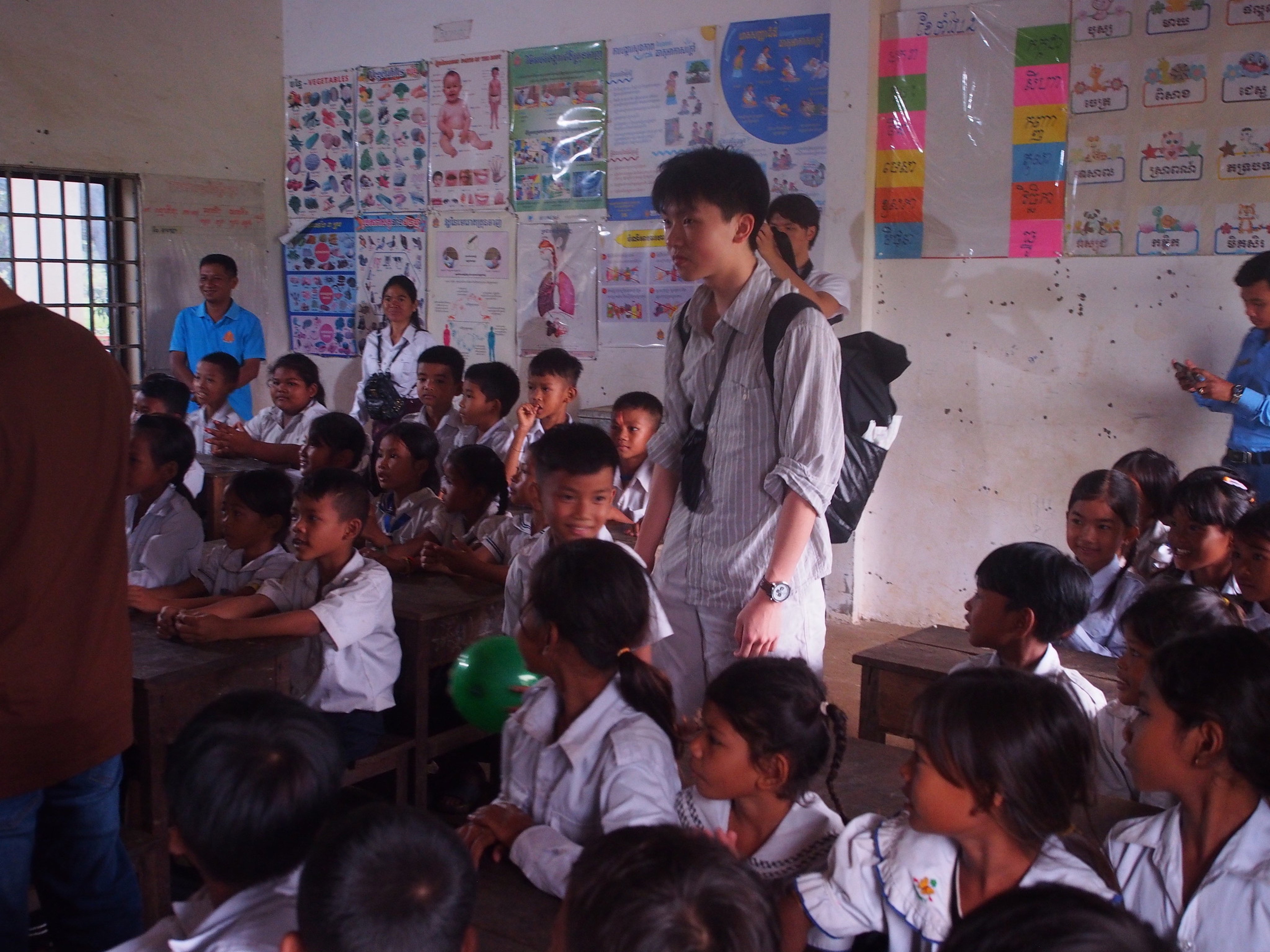 Alfred Lam joins a health education activity with schoolchildren during a medical outreach trip to Cambodia. Photo: Handout
