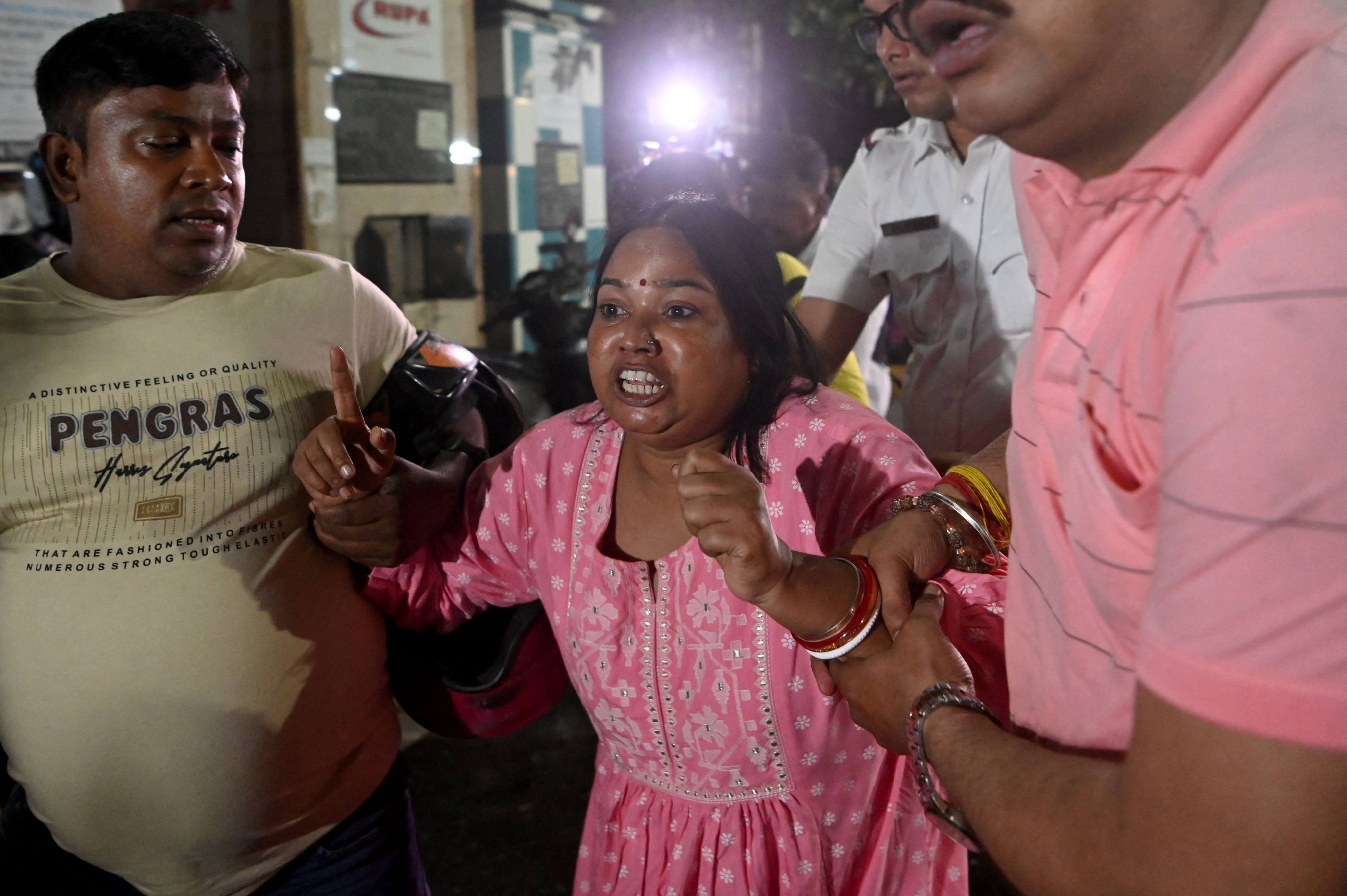 Relatives of stampede victims react outside Calcutta Medical College and Hospital in Kolkata on Saturday. Photo: AFP