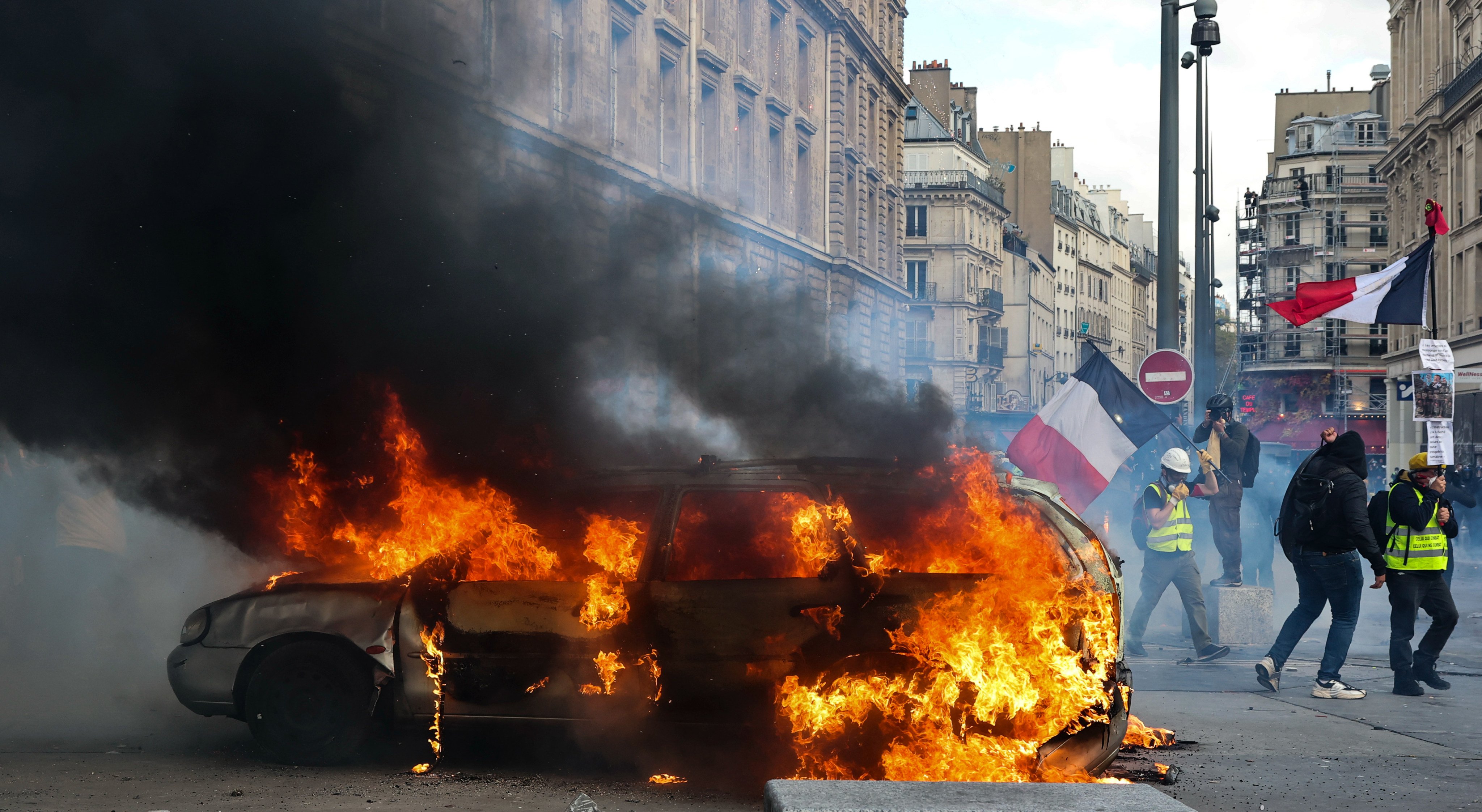 A burning vehicle during a protest in Paris on Saturday. Photo: Xinhua