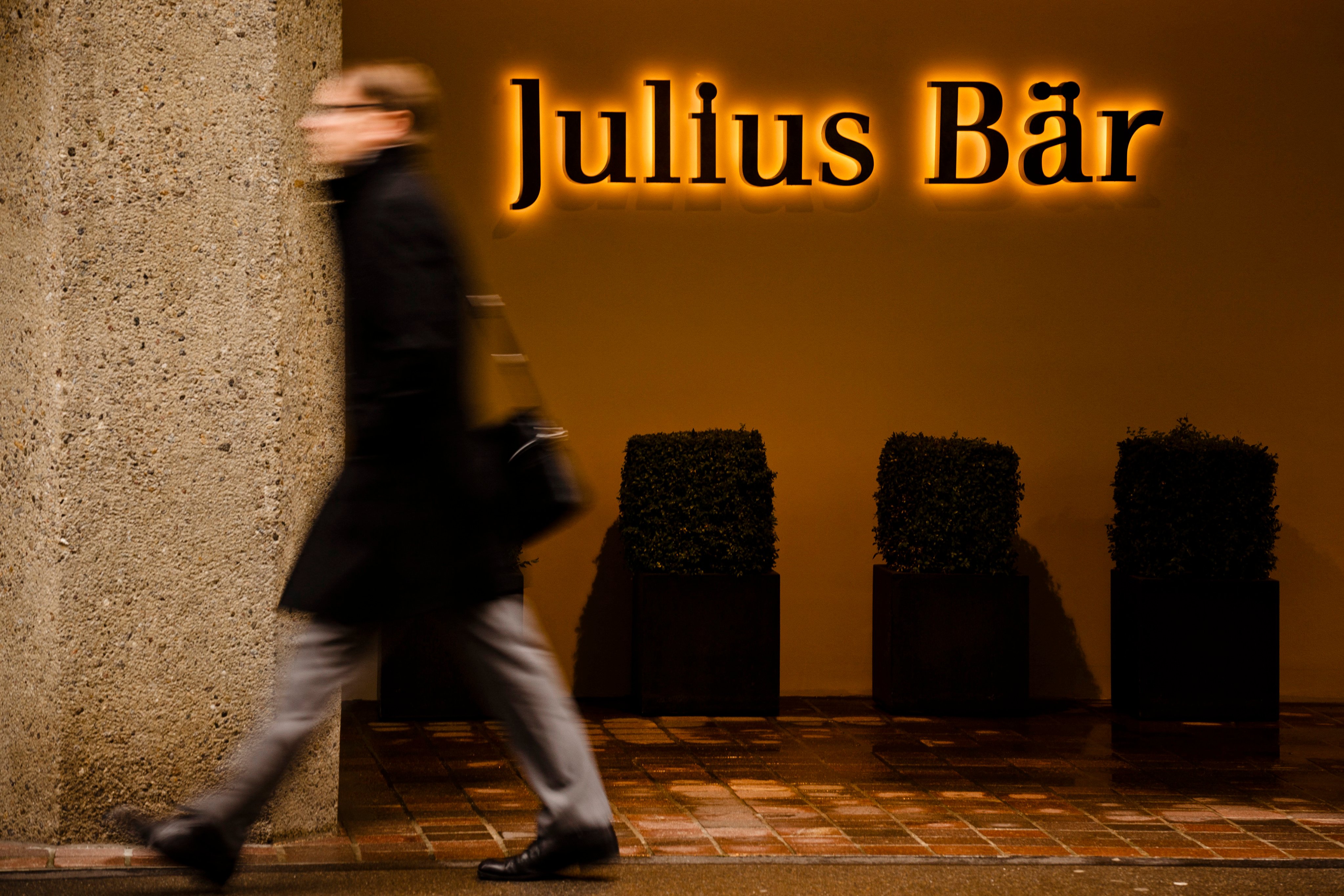 A man walks past the logo of the Swiss bank Julius Baer group at the company’s headquarters in Zurich. Photo: AFP