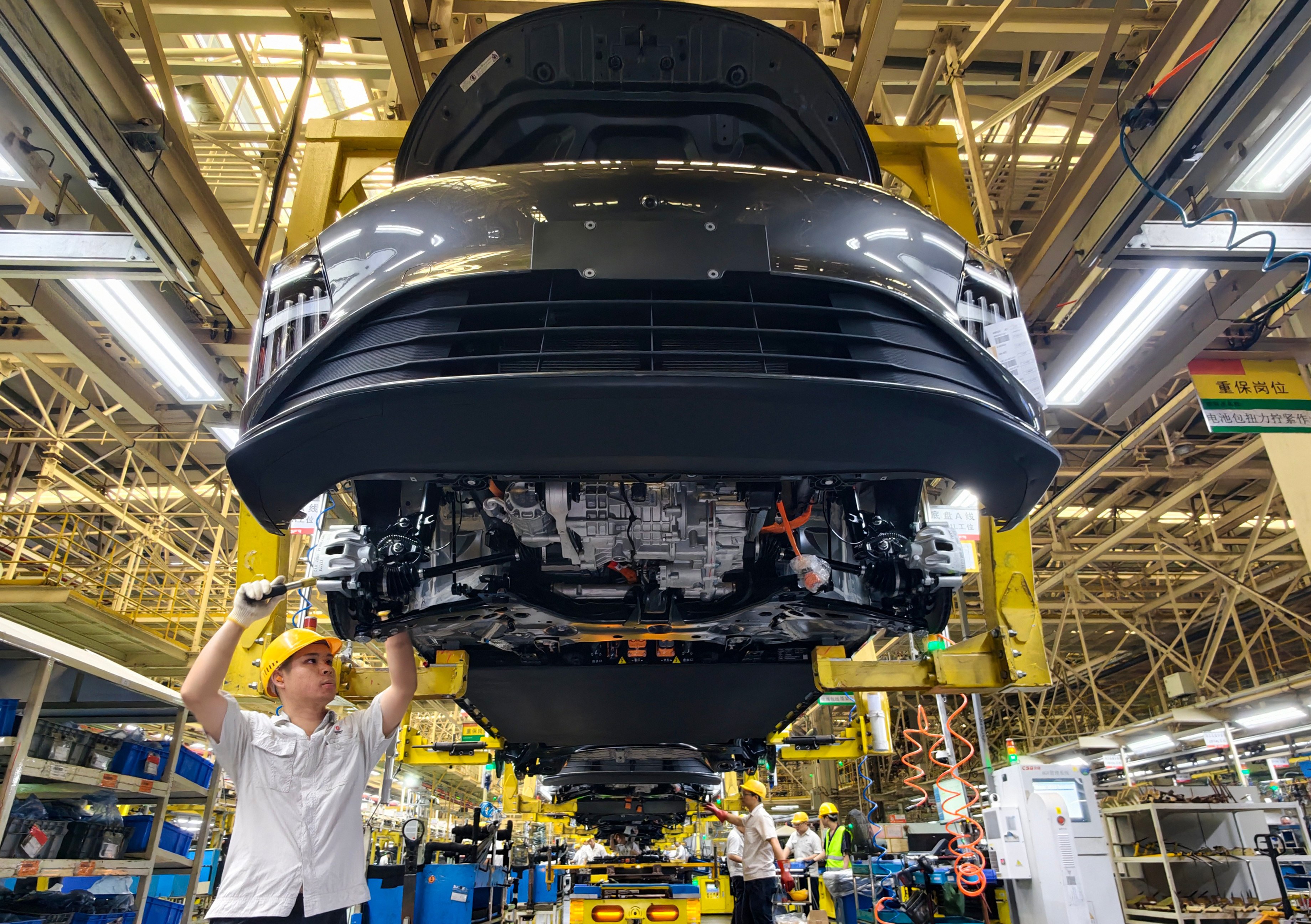Workers on a Dongfeng Liuzhou Motor’s electric vehicle production line in Liuzhou, Guangxi Zhuang autonomous region, last month. Photo: VCG via Getty Images