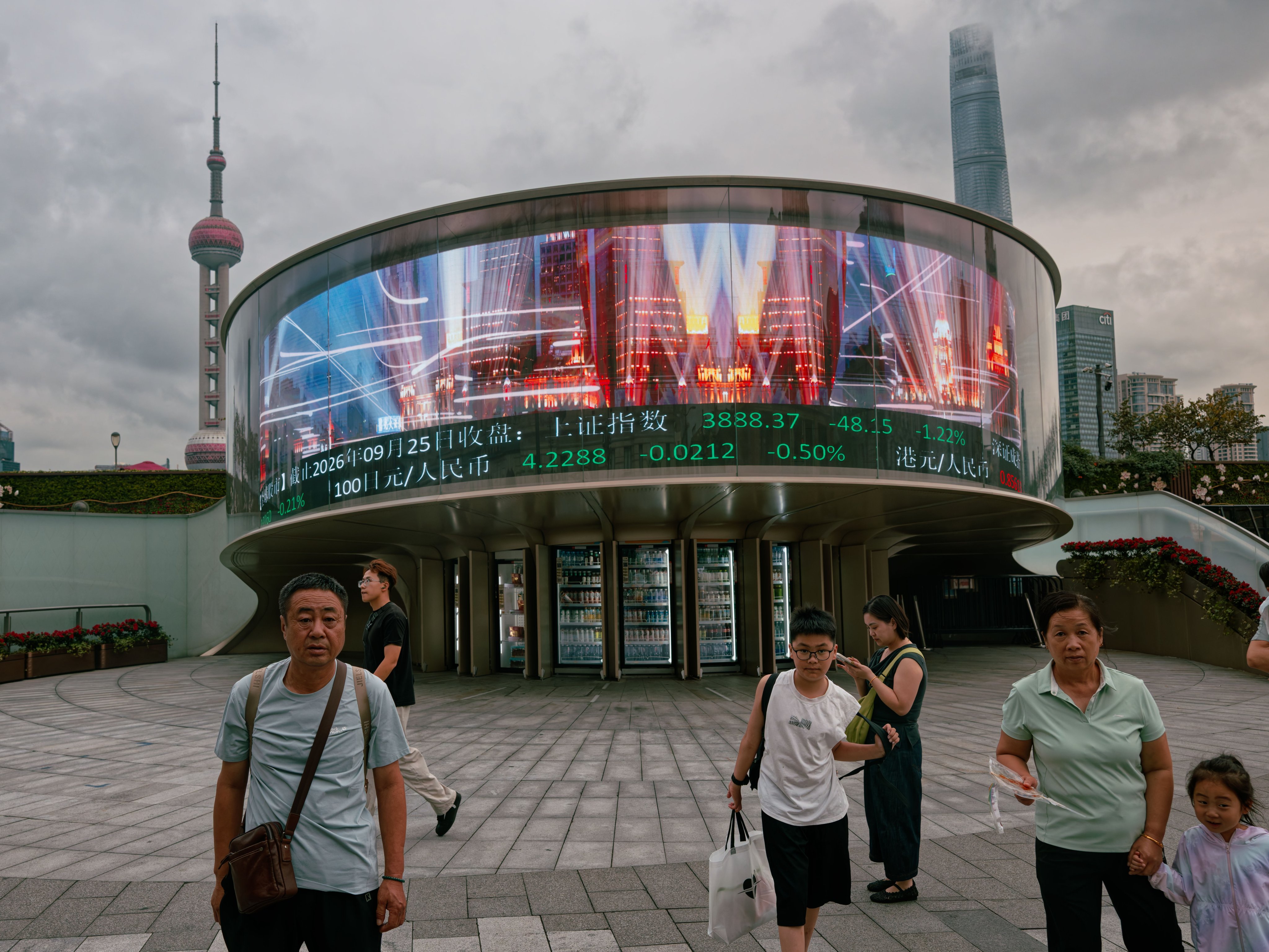 A screen in Shanghai displaying stock exchange and economic data in September. Photo: EPA