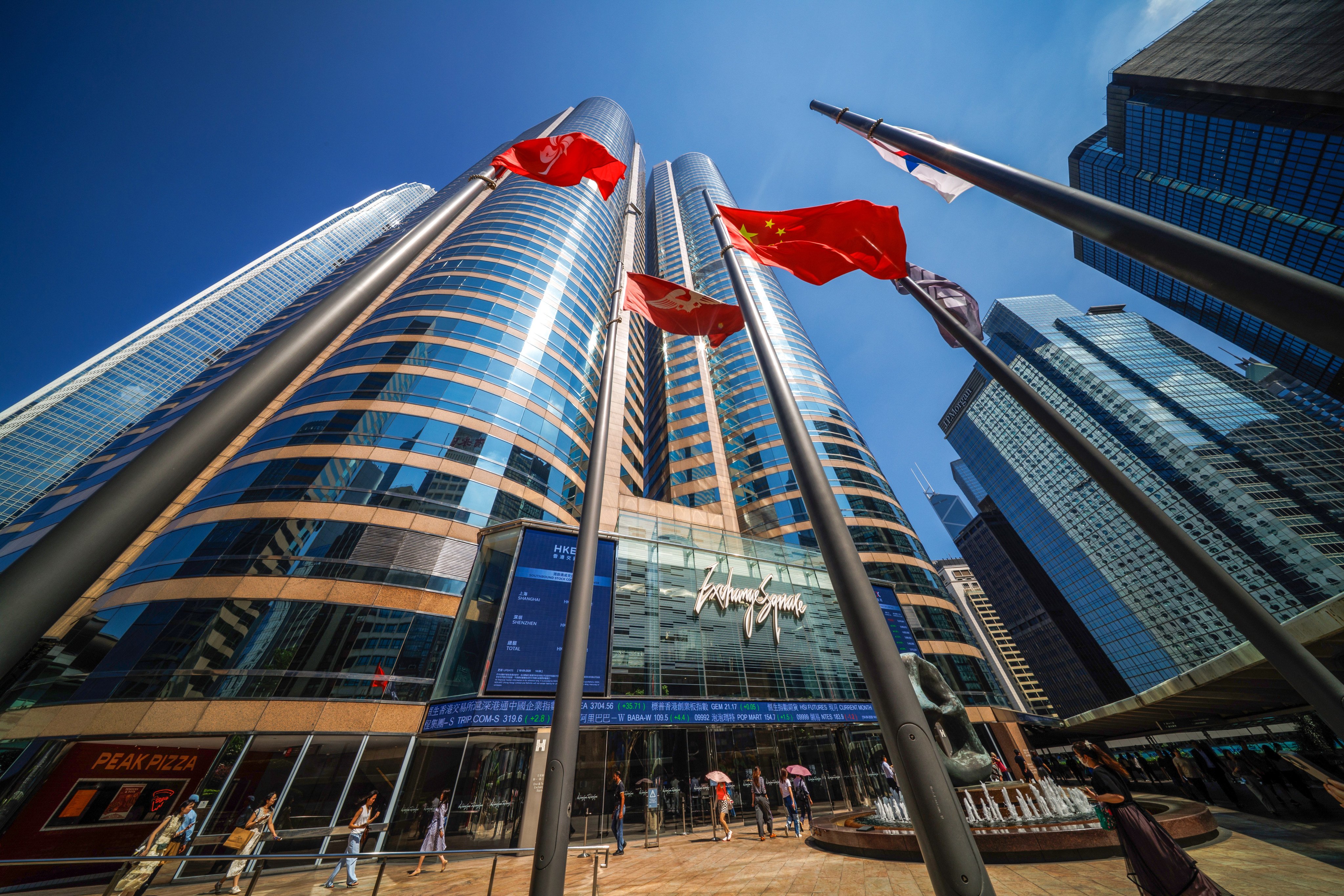 Flags fly outside the Hong Kong stock exchange in Exchange Square, Central. Photo: Dickson Lee