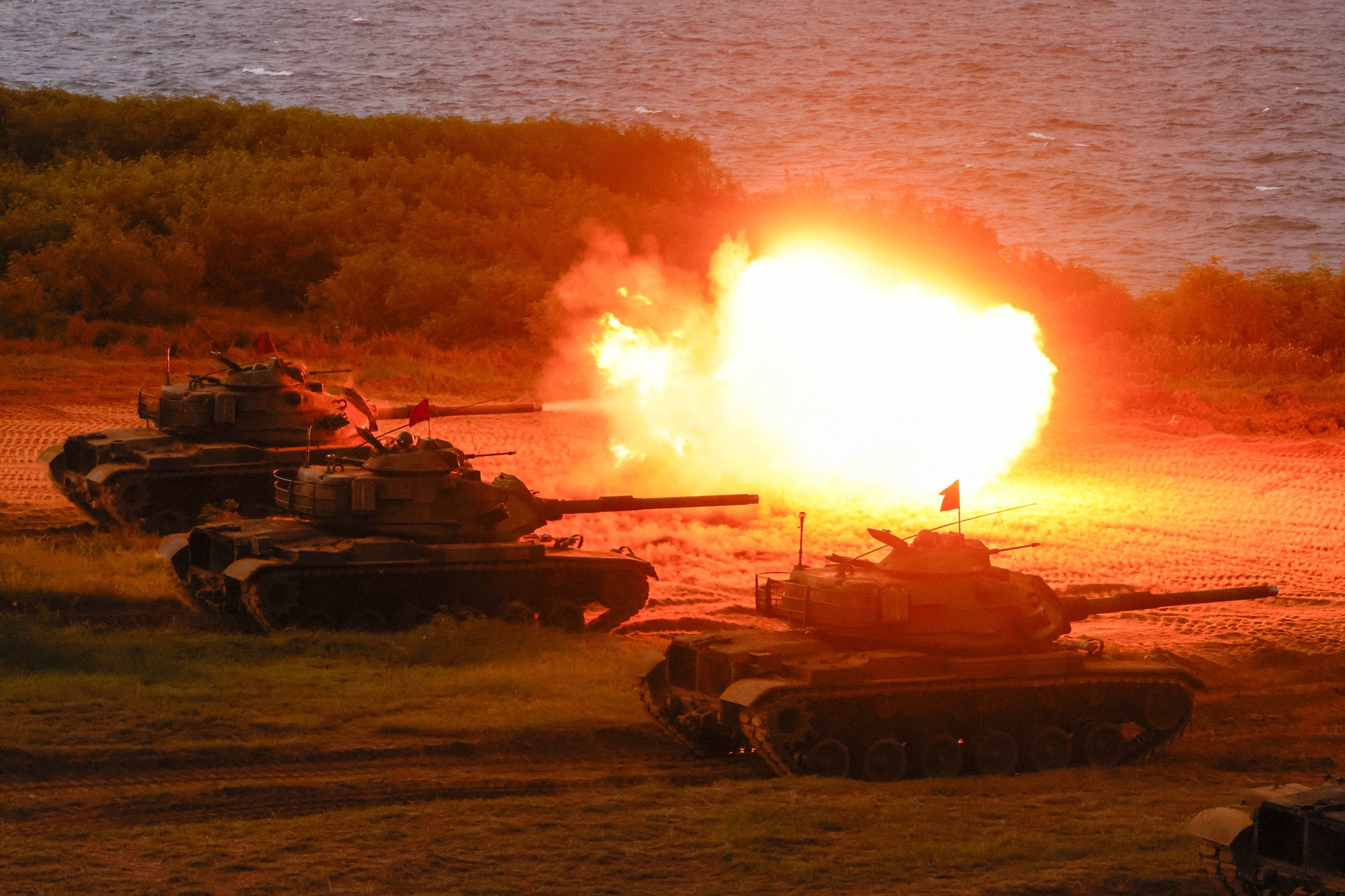 Taiwanese tanks fire during a live-fire drill in Penghu on August 10 as part of the annual Han Kuang military exercises. Photo: Reuters
