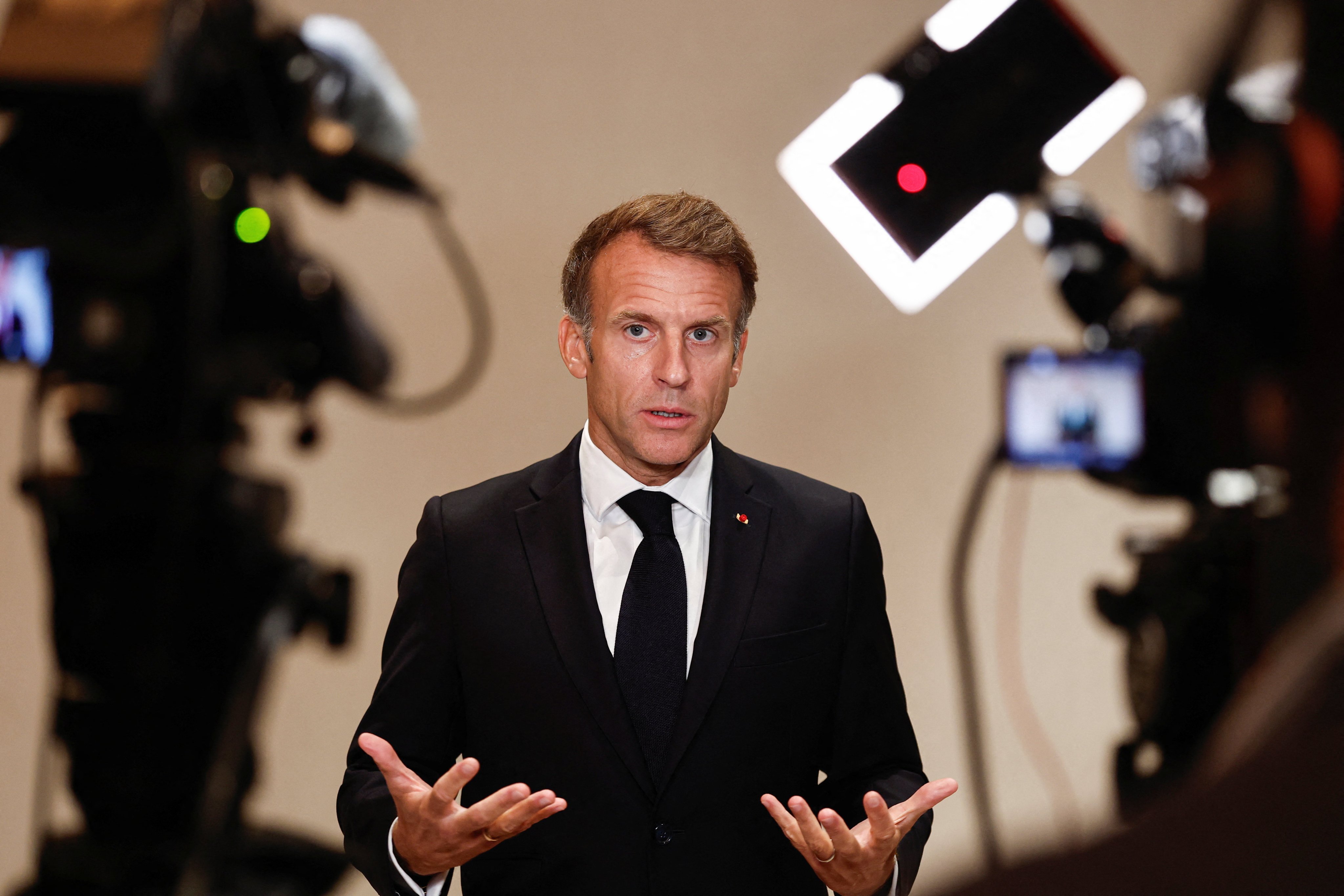 French President Emmanuel Macron speaks to the media in Lusail, Qatar, on Wednesday. Photo: EPA