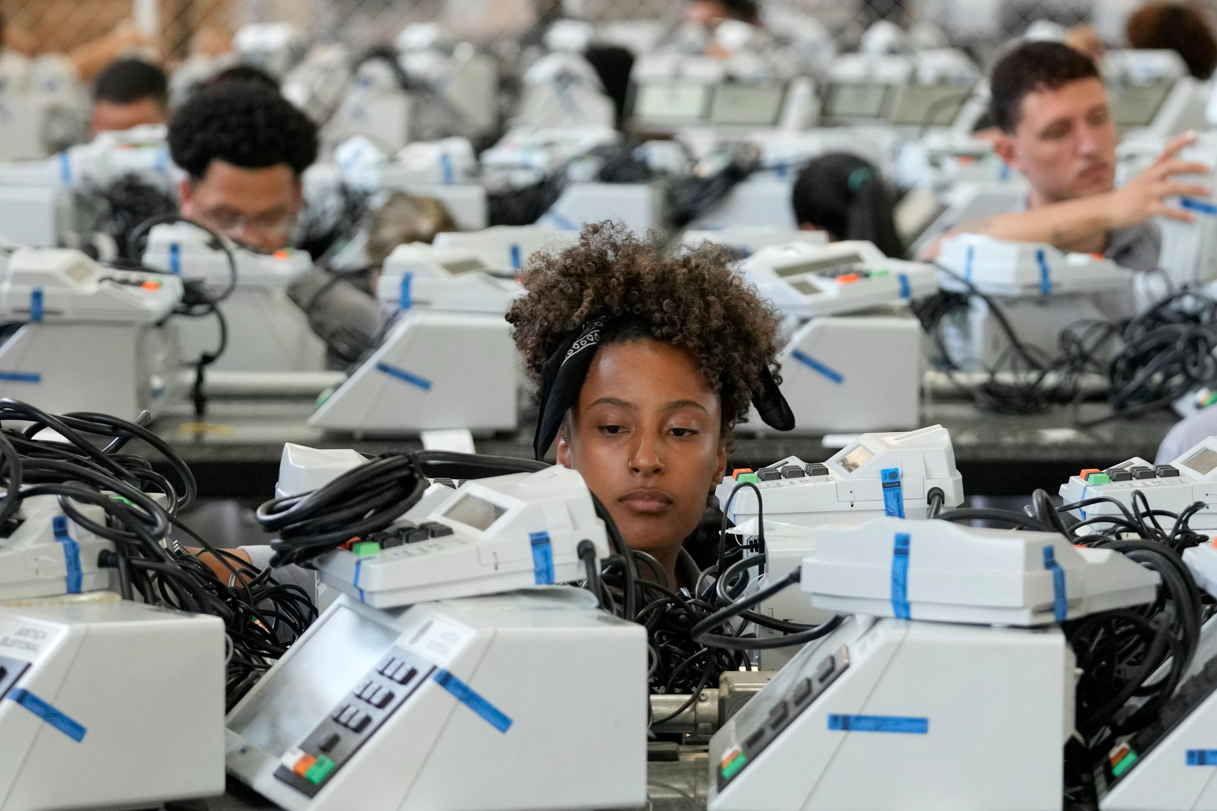 Electronic voting machines are prepared in Brasilia ahead of Sunday’s presidential run-off, as both campaigns mount eleventh-hour challenges at the country’s top electoral court. Photo: AP