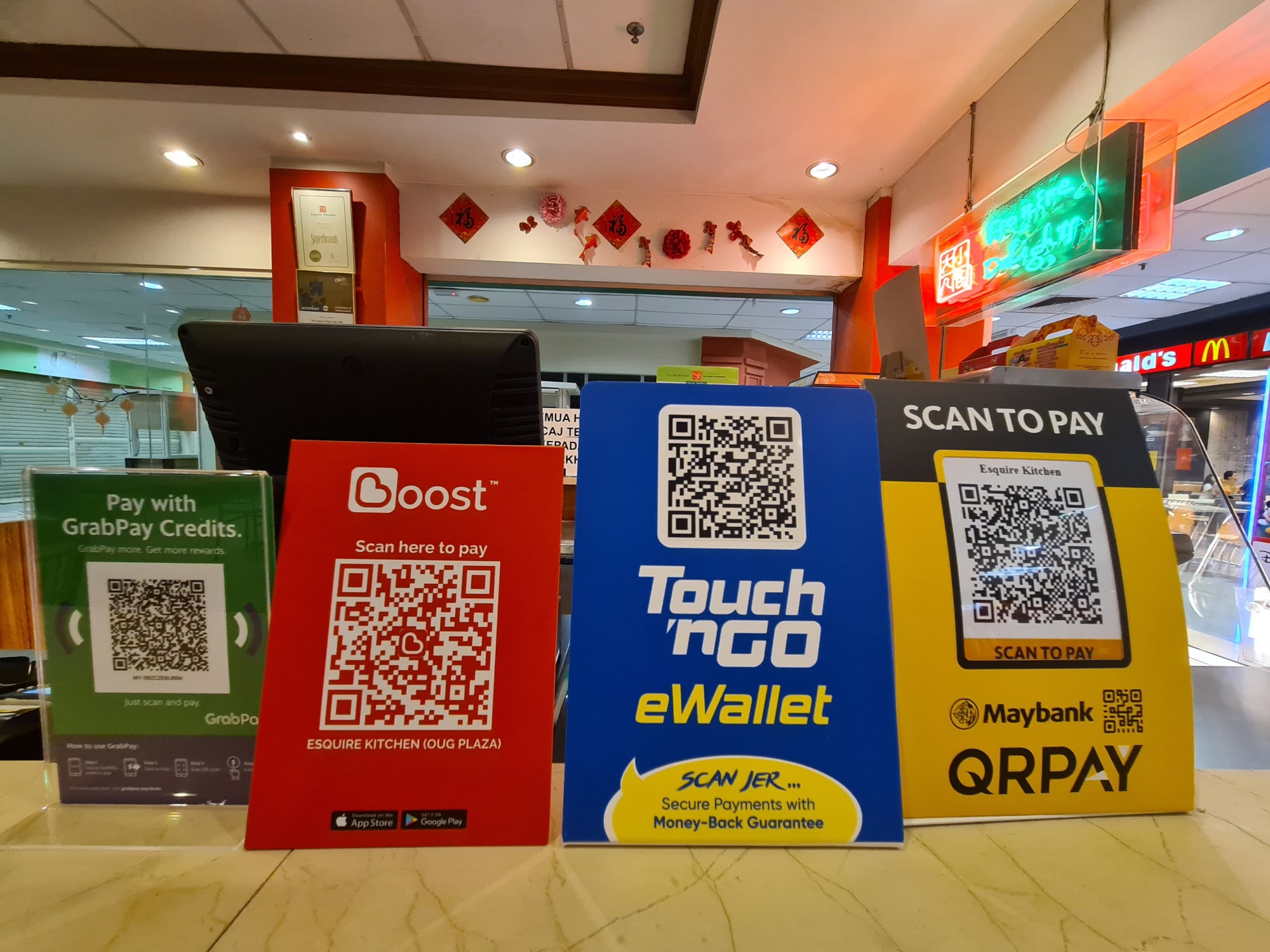Several digital cashless methods on display at a restaurant in Malaysia. Photo: Shutterstock