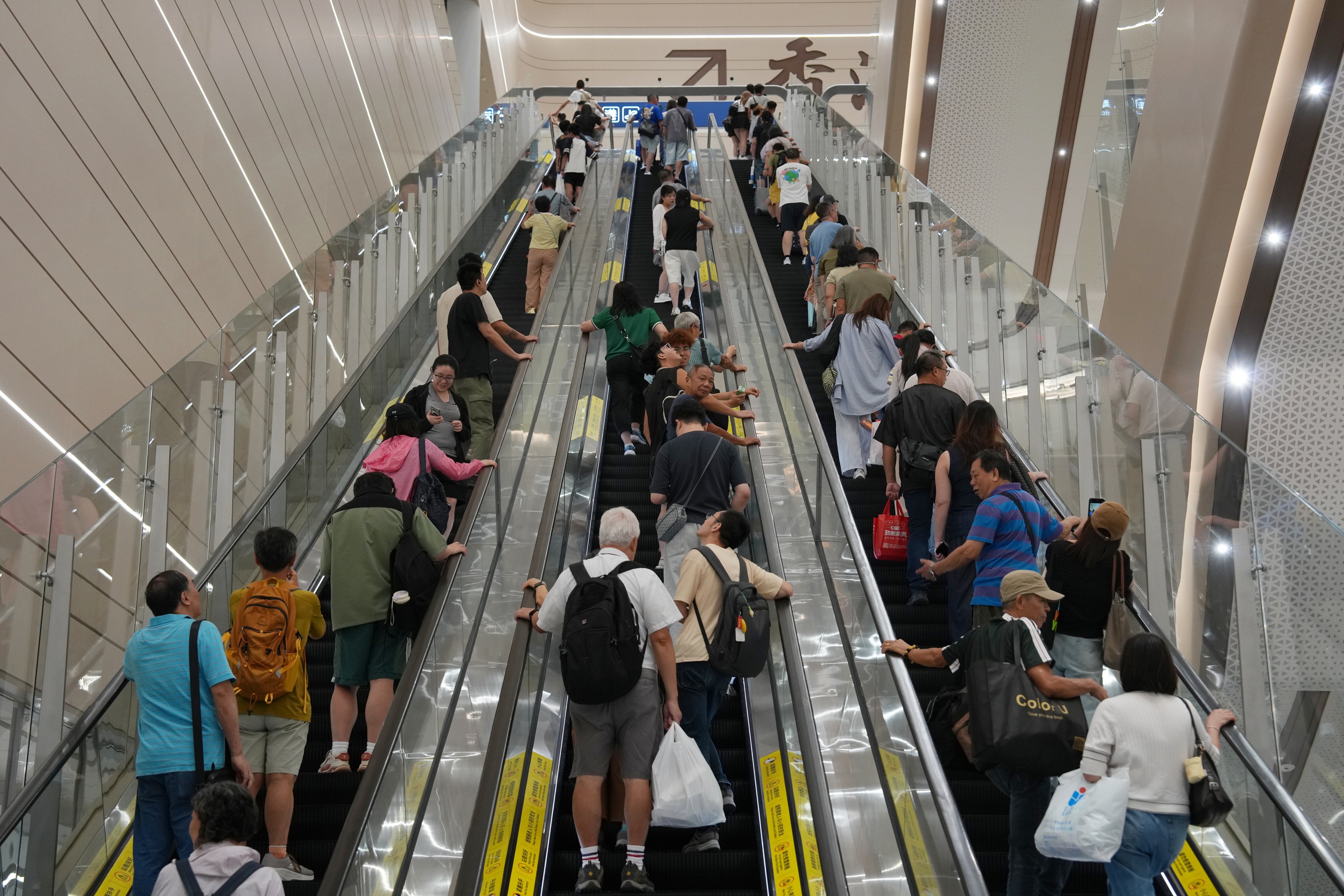 Travellers head to Hong Kong through the revamped Huanggang Port on the last day of Chung Yeung Festival long weekend on Monday. Photo: Kit Lai