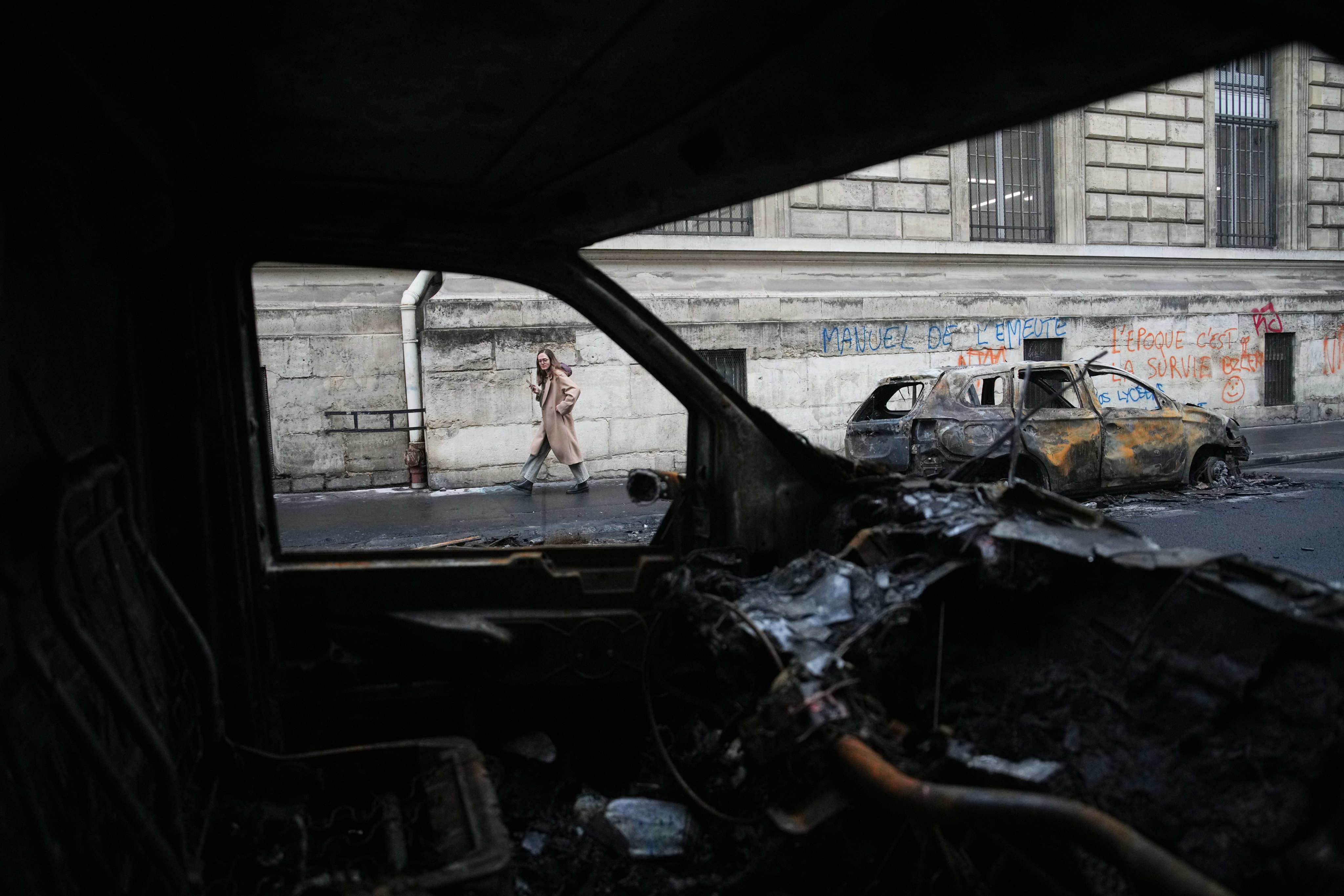 Scorched wreckage on a Paris street after weekend rioting prompted plans for military deployments ahead of Saturday’s protests. Photo: AP