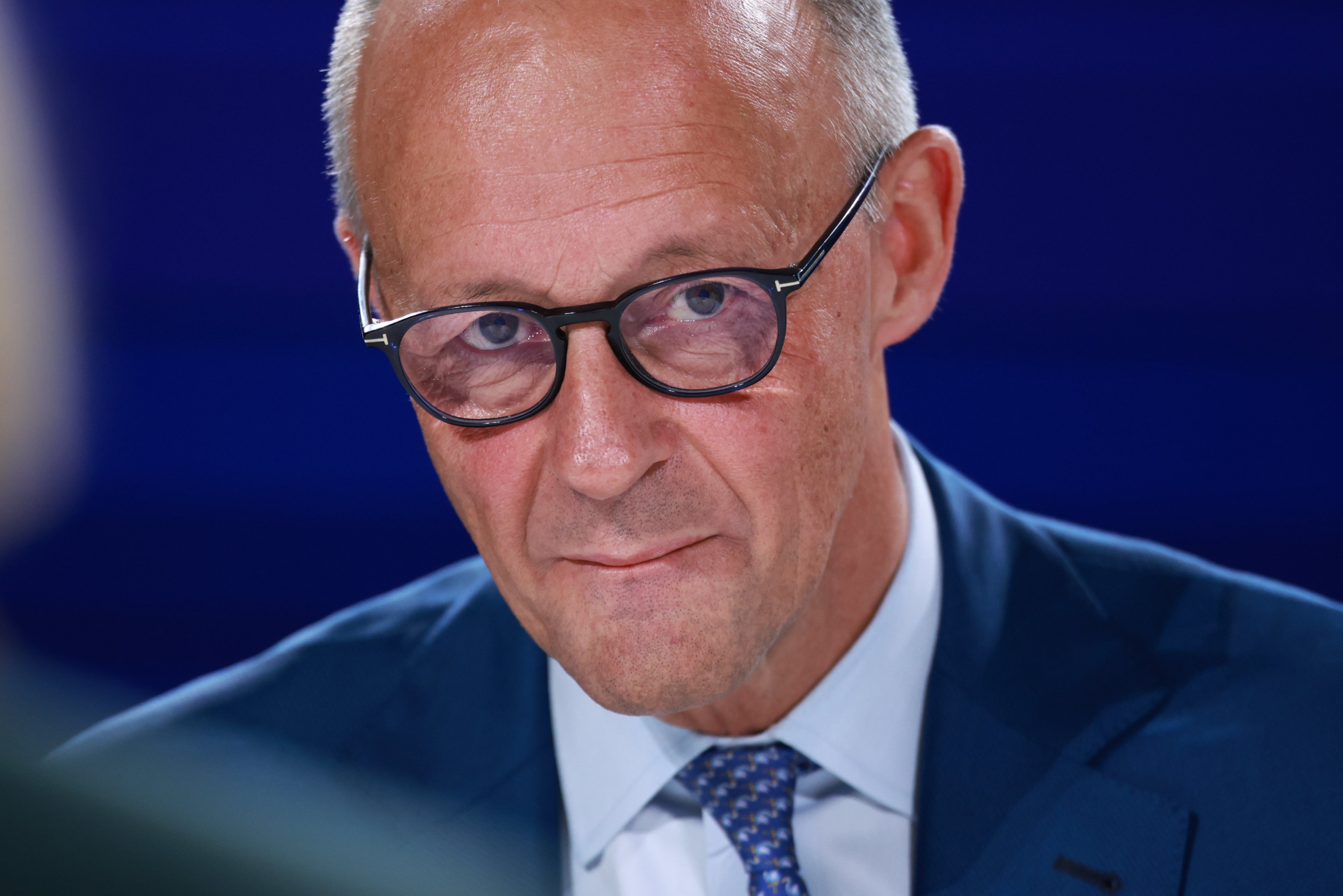 German Chancellor Friedrich Merz looks on as he takes part in a talk during the Berlin Global Dialogue 2026 in Berlin, Germany, on Wednesday. Photo: EPA