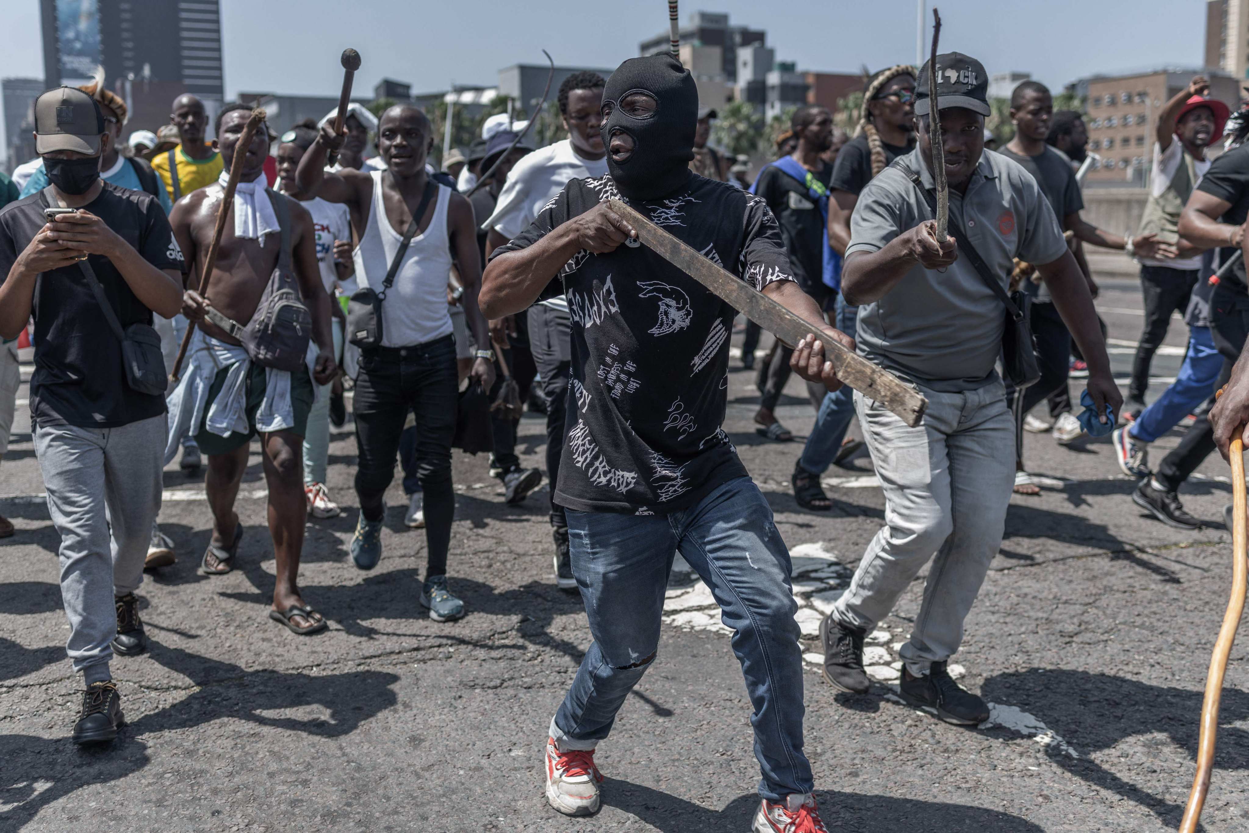 Anti-migrant protesters chant slogans during a march in Durban on October 9. Photo: AFP