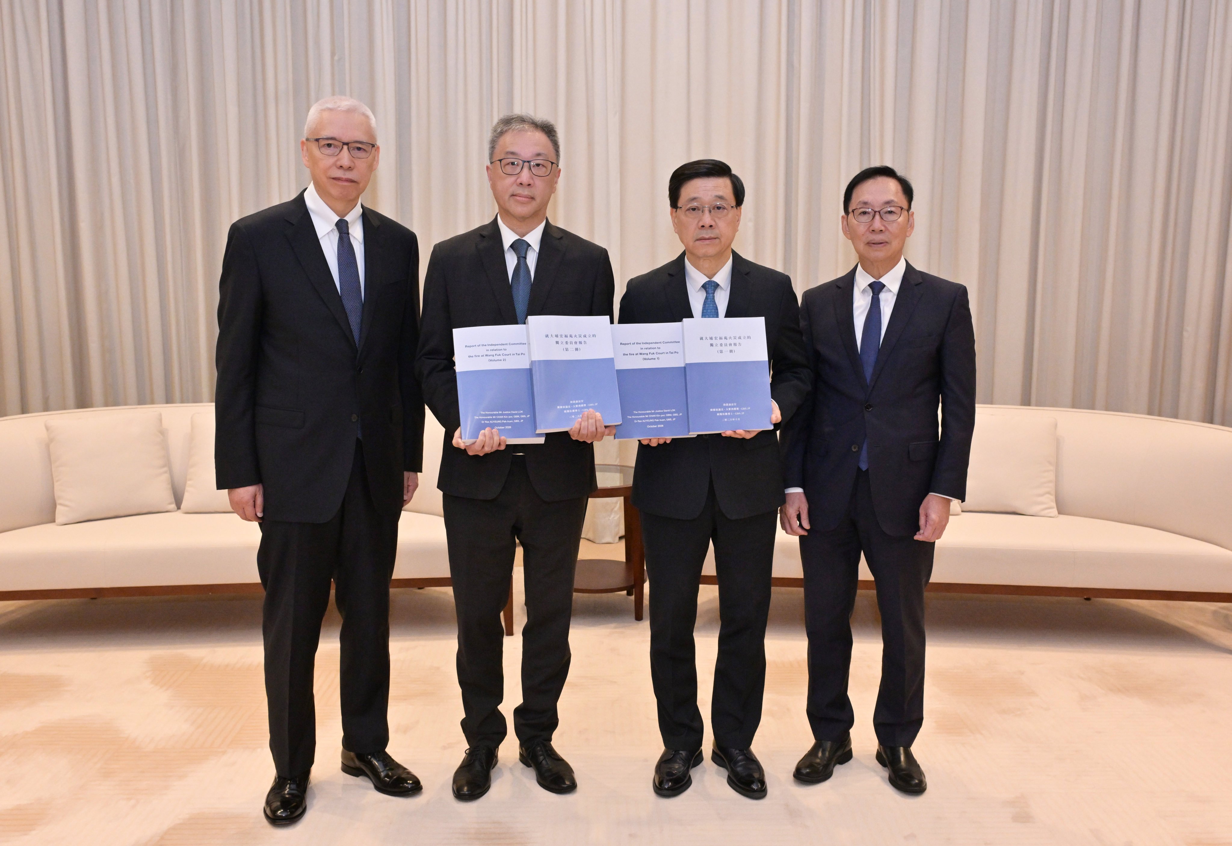 City leader John Lee (second from right) receives the report on Thursday. Photo: Handout