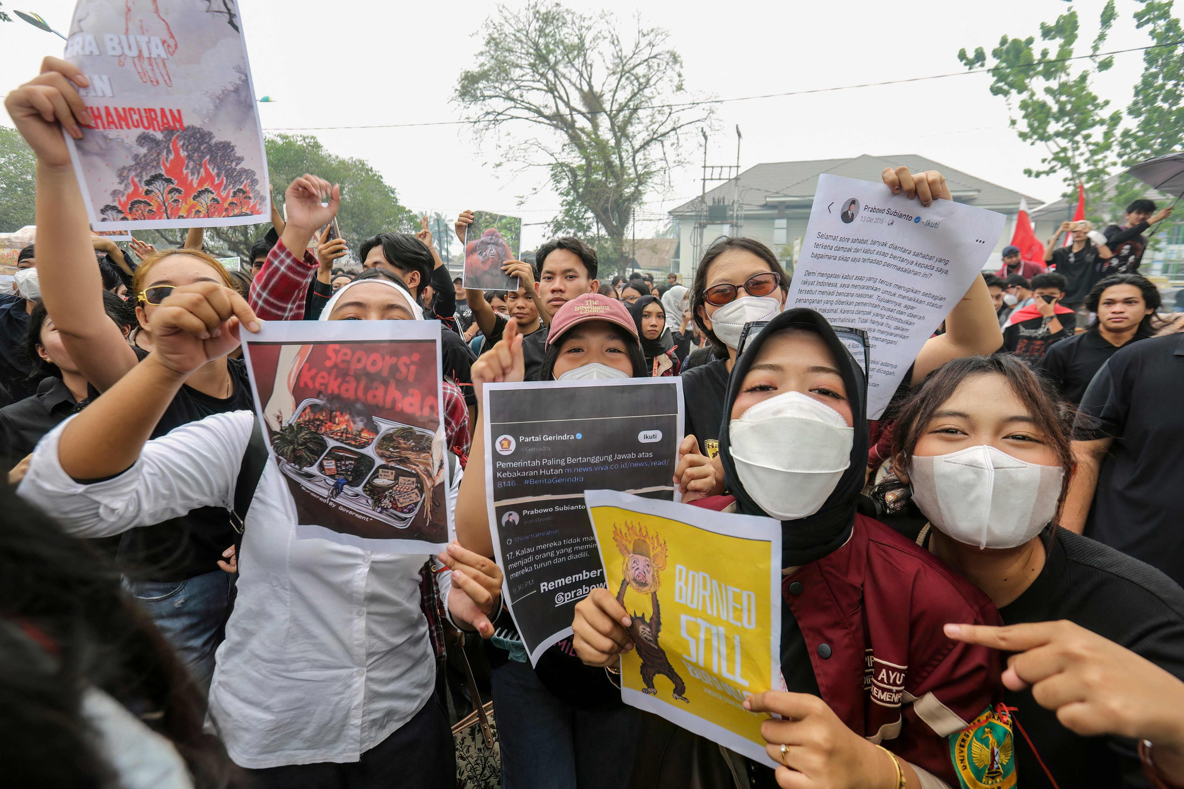 Protesters rally outside the Central Kalimantan Governor’s office in Palangkaraya, Indonesia, on Monday, demanding government action on forest fires. Photo: AFP