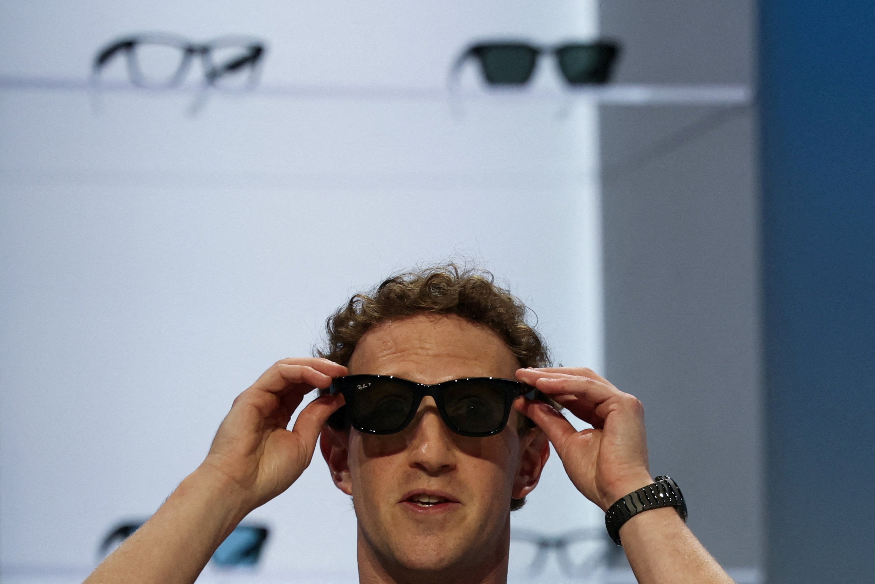 Meta Platforms CEO Mark Zuckerberg tries on the company’s smart glasses at an event in California, US, last month. Photo: Reuters