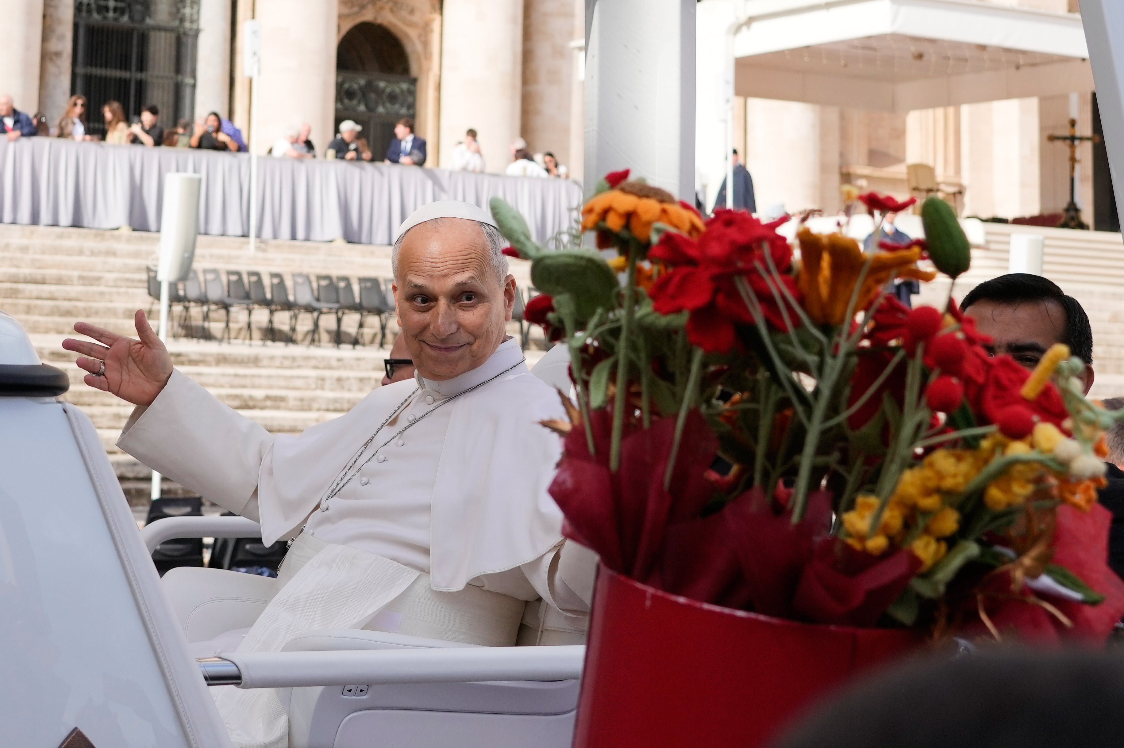 Pope Leo is presented with flowers as he leaves at the end of the general audience in St Peter’s Square at The Vatican on Wednesday. Photo: AP