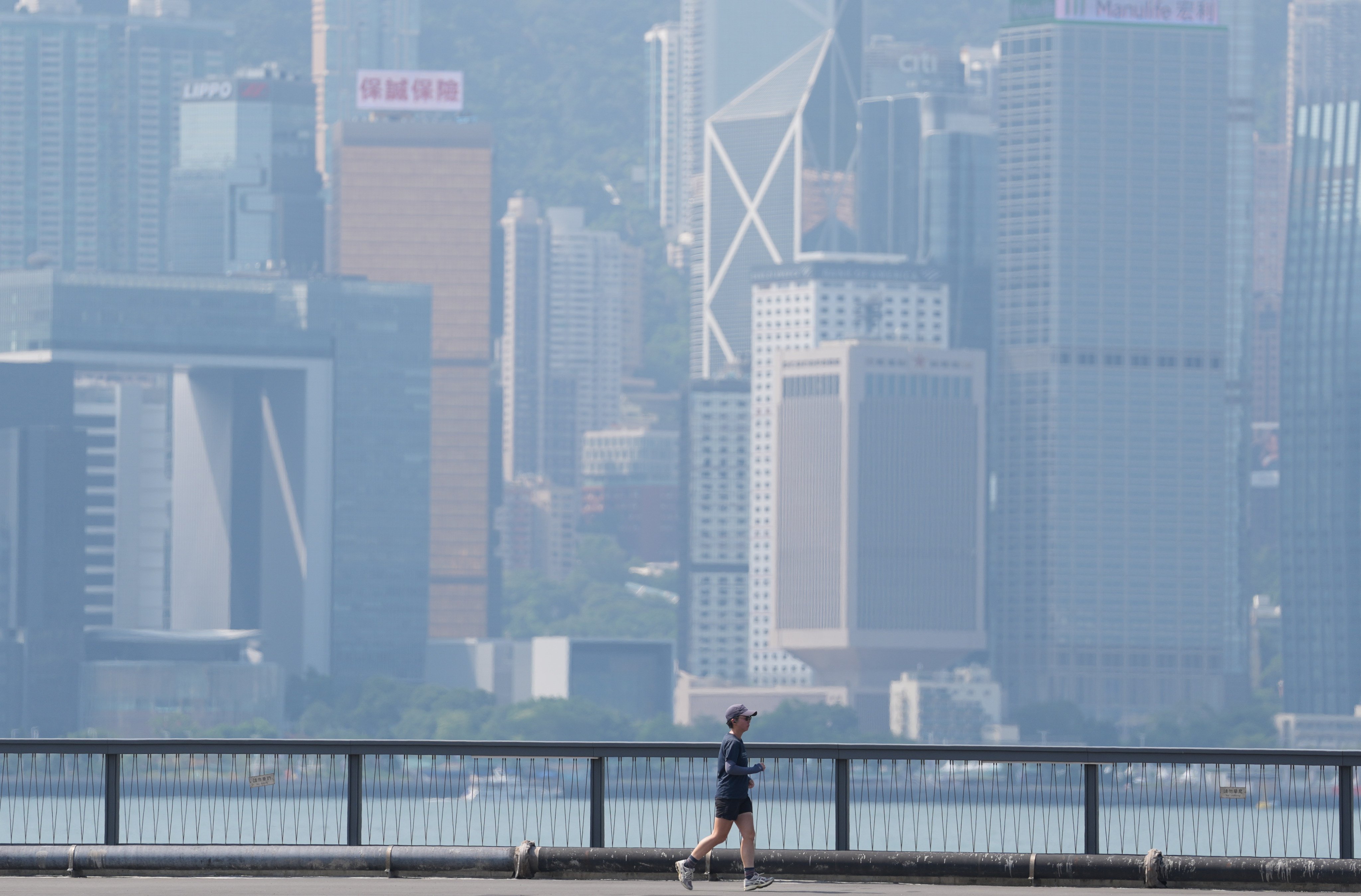 Haze obscures the Hong Kong skyline along the Hung Hom waterfront. Photo: Sam Tsang