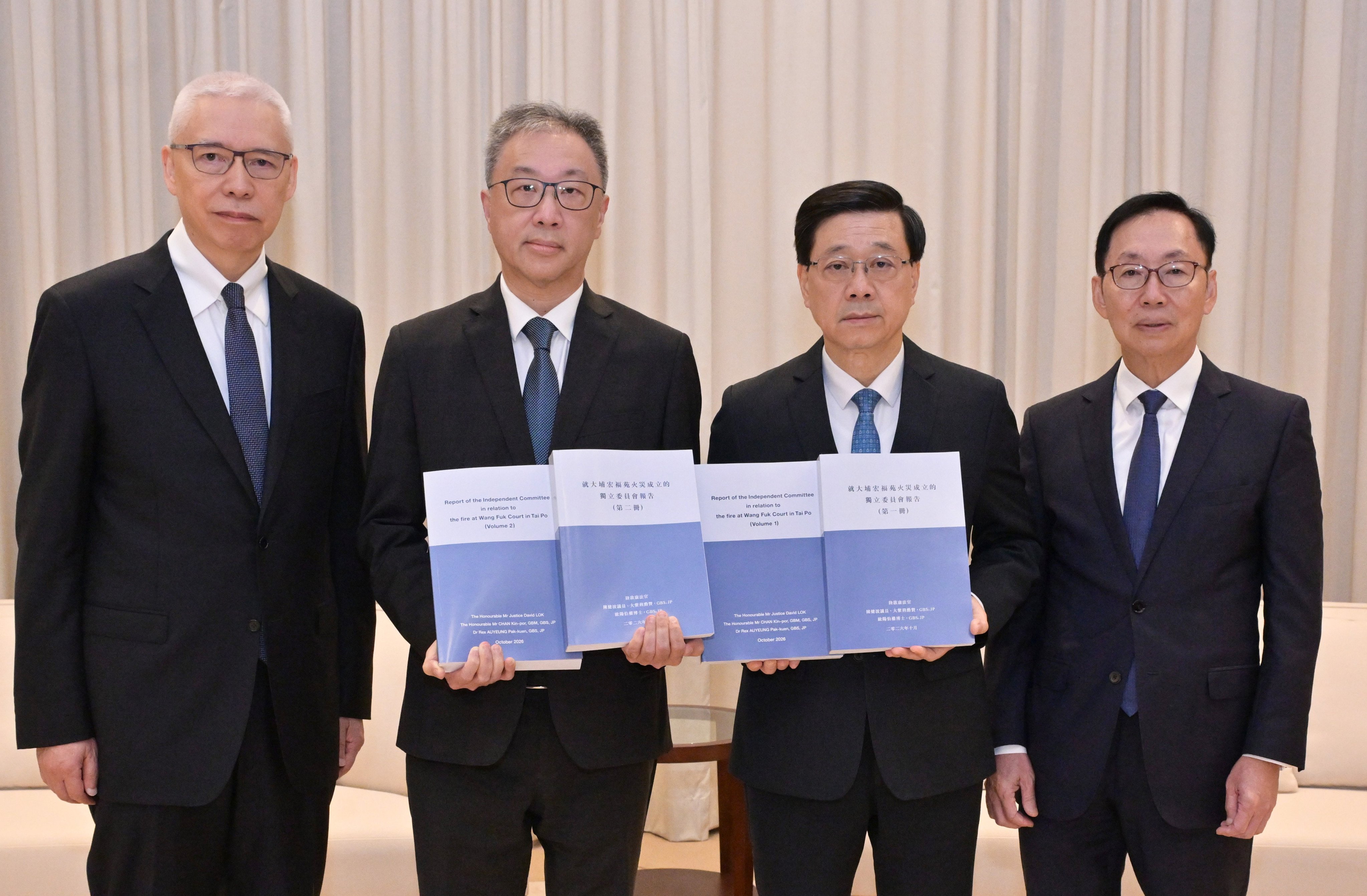 City leader John Lee (second from right) receives the report from the committee headed by judge David Lok Kai-hong (second left) on Thursday. Photo: Handout