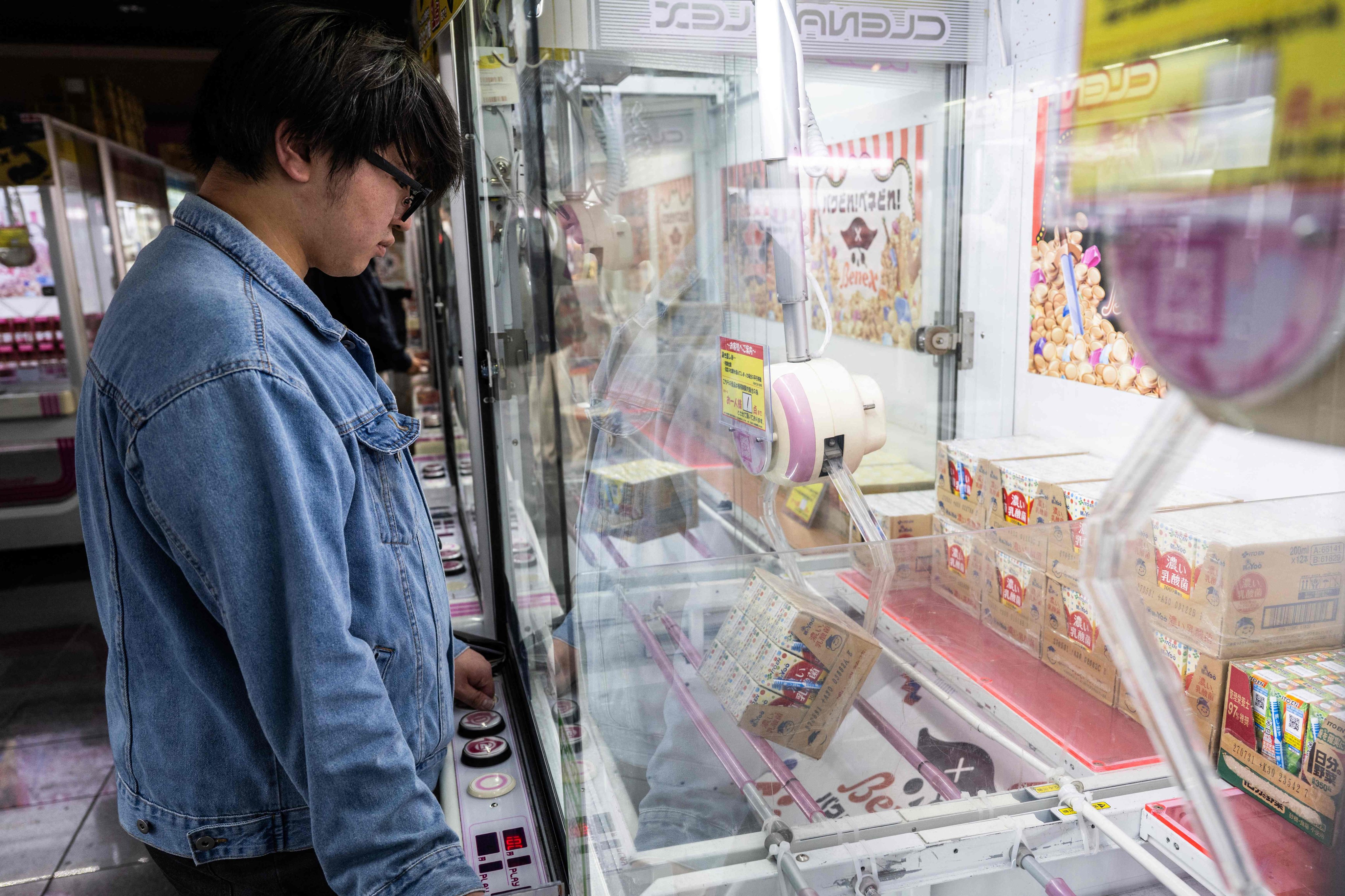 Inflation-squeezed Japanese flock to claw machines dangling everyday ...