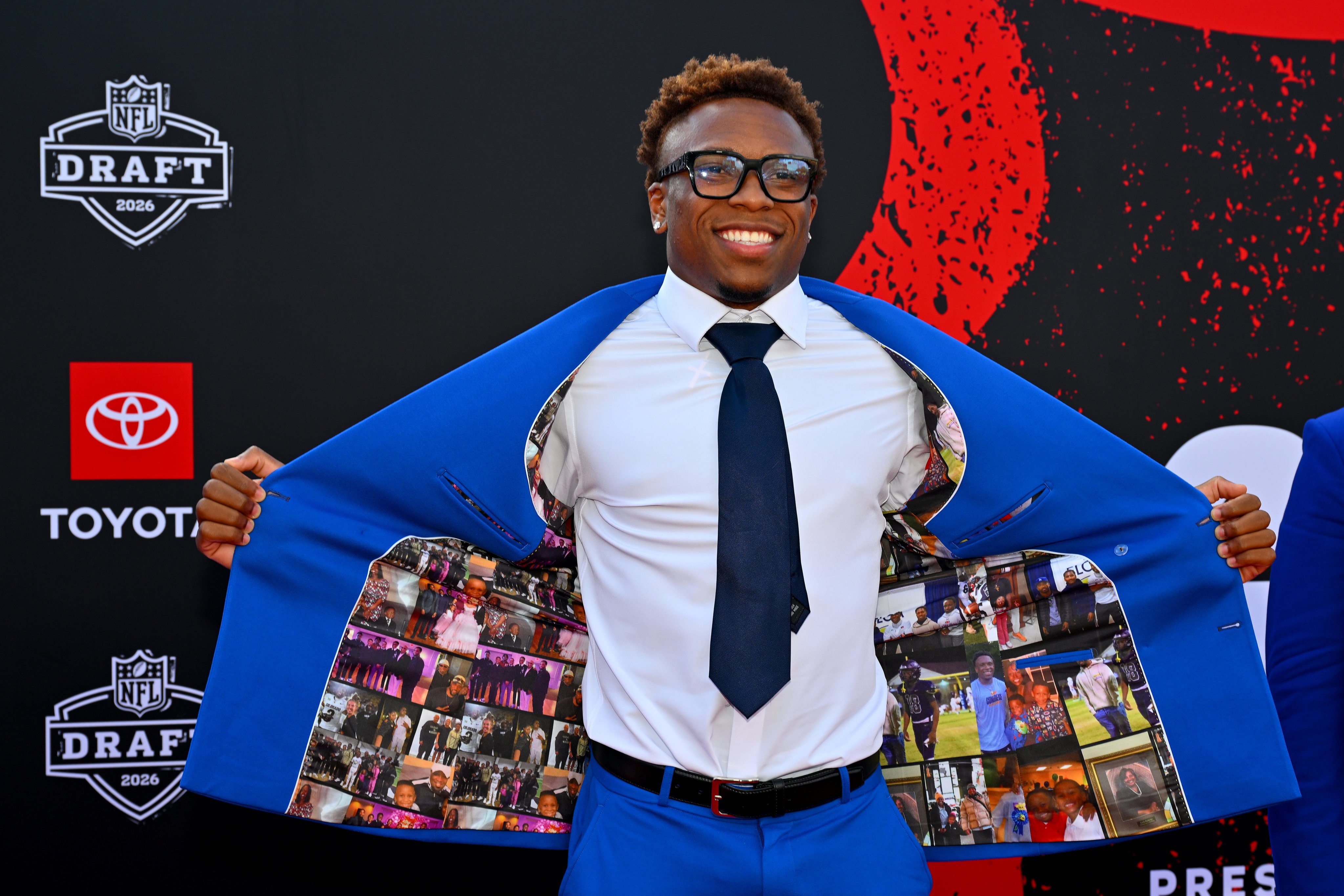 Colton Hood showcases the unique lining of his suit at the 2026 NFL draft in Pittsburgh, Pennsylvania. Photo: Getty Images