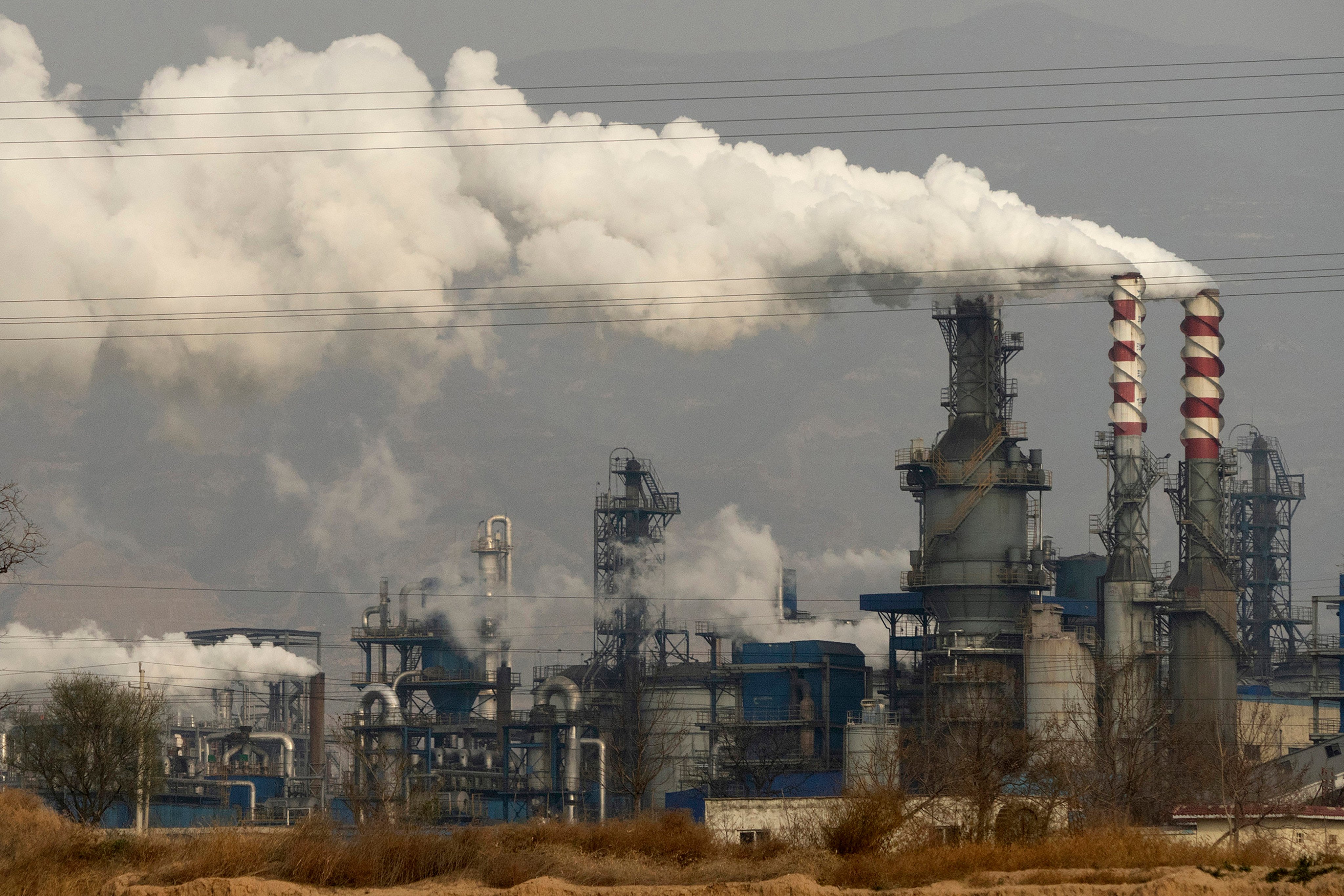 Smoke and steam rise from a coal processing plant in Hejin in China’s central Shanxi province on November 28, 2019. Photo: AP/File photo
