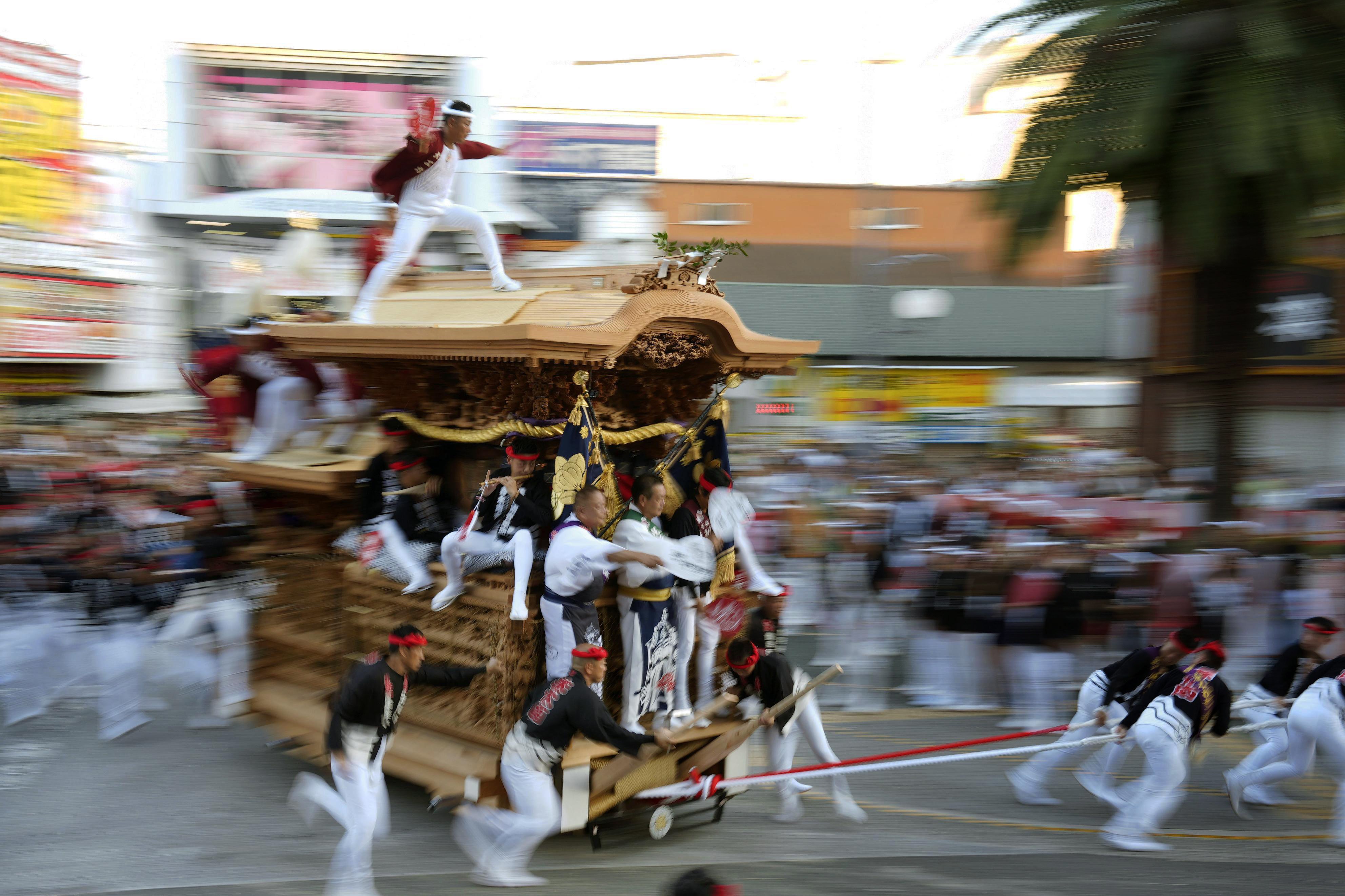 People pull a traditional danjiri wooden float through Kishiwada, Osaka prefecture, Japan, on the first day of the annual Danjiri festival in September 2024. Photo: Kyodo