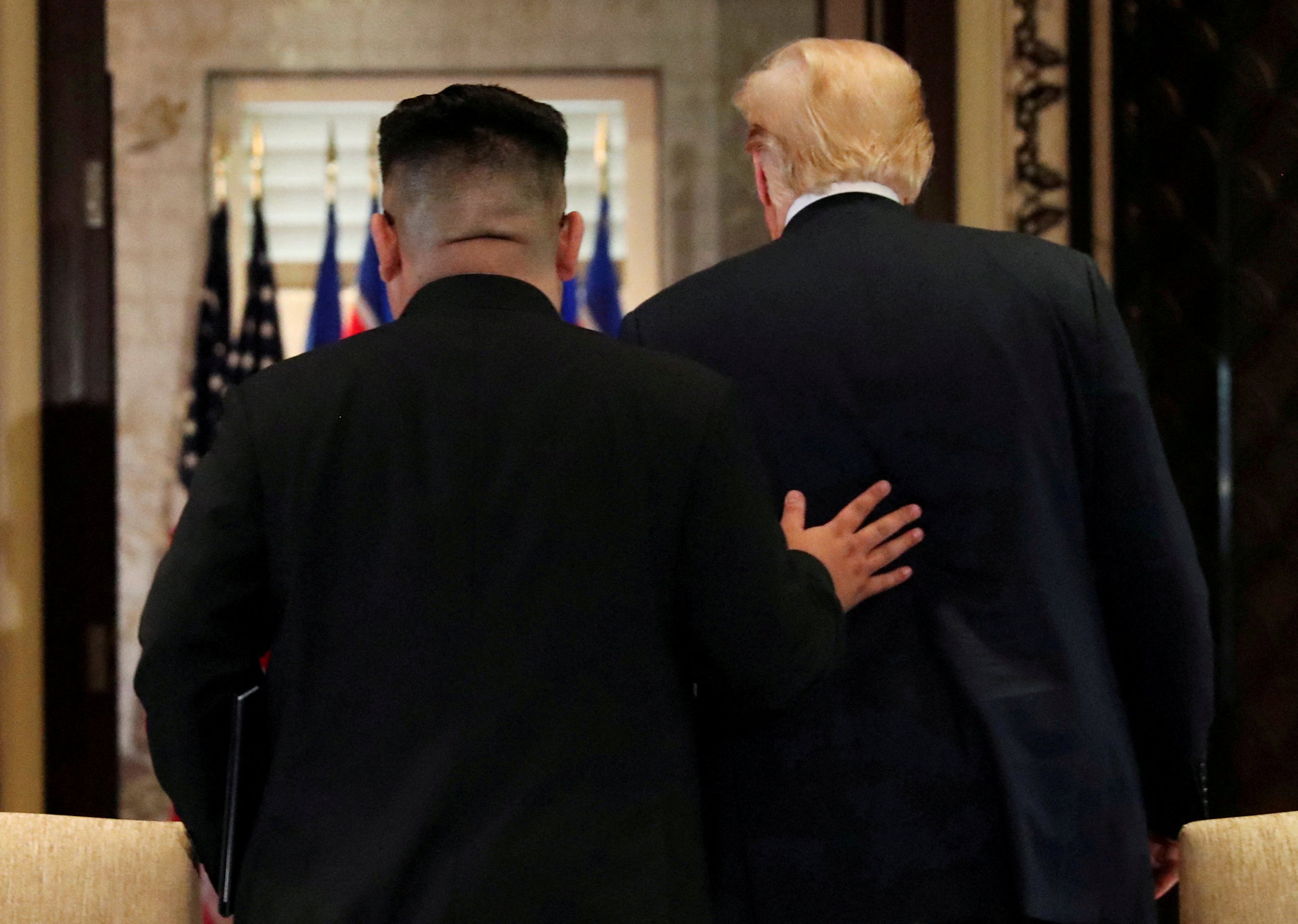 US President Donald Trump (right) and North Korean leader Kim Jong-un leave after after their summit in Singapore on June 12, 2018. Photo: Reuters