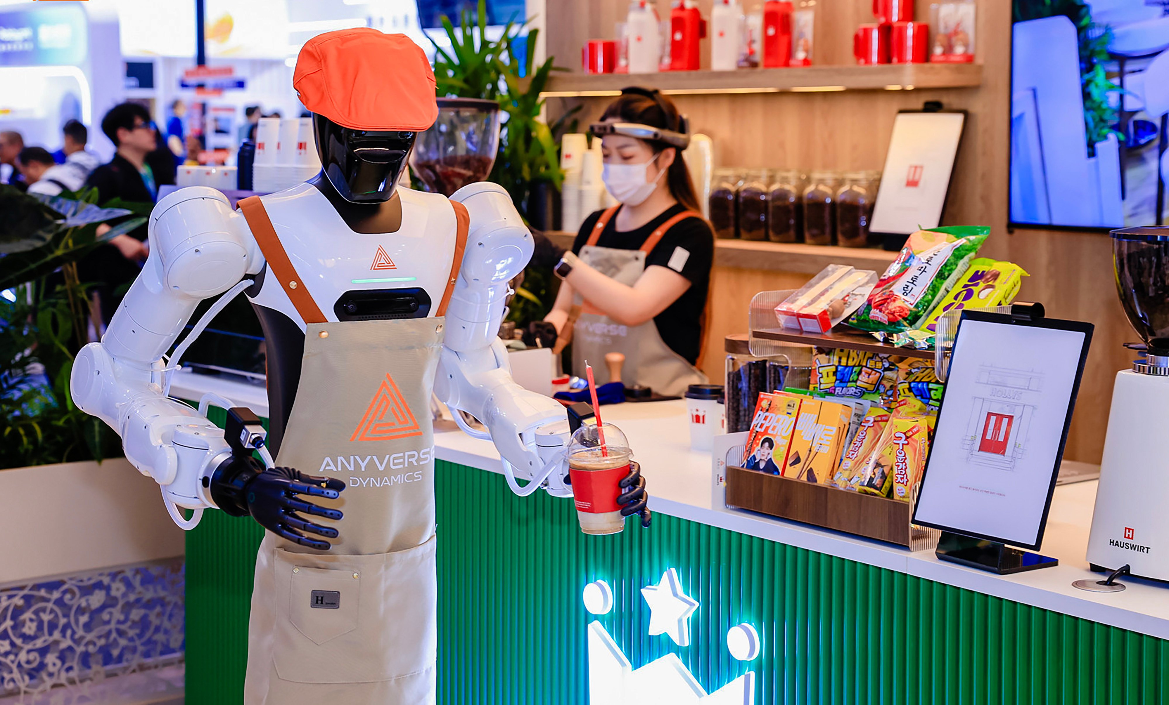 Chinese start-up Anyverse Dynamics teamed up with Korean coffee chain Hollys to test robots that serve drinks, clear tables and reset seats at the World Robot Conference in August in Beijing. Photo: Handout