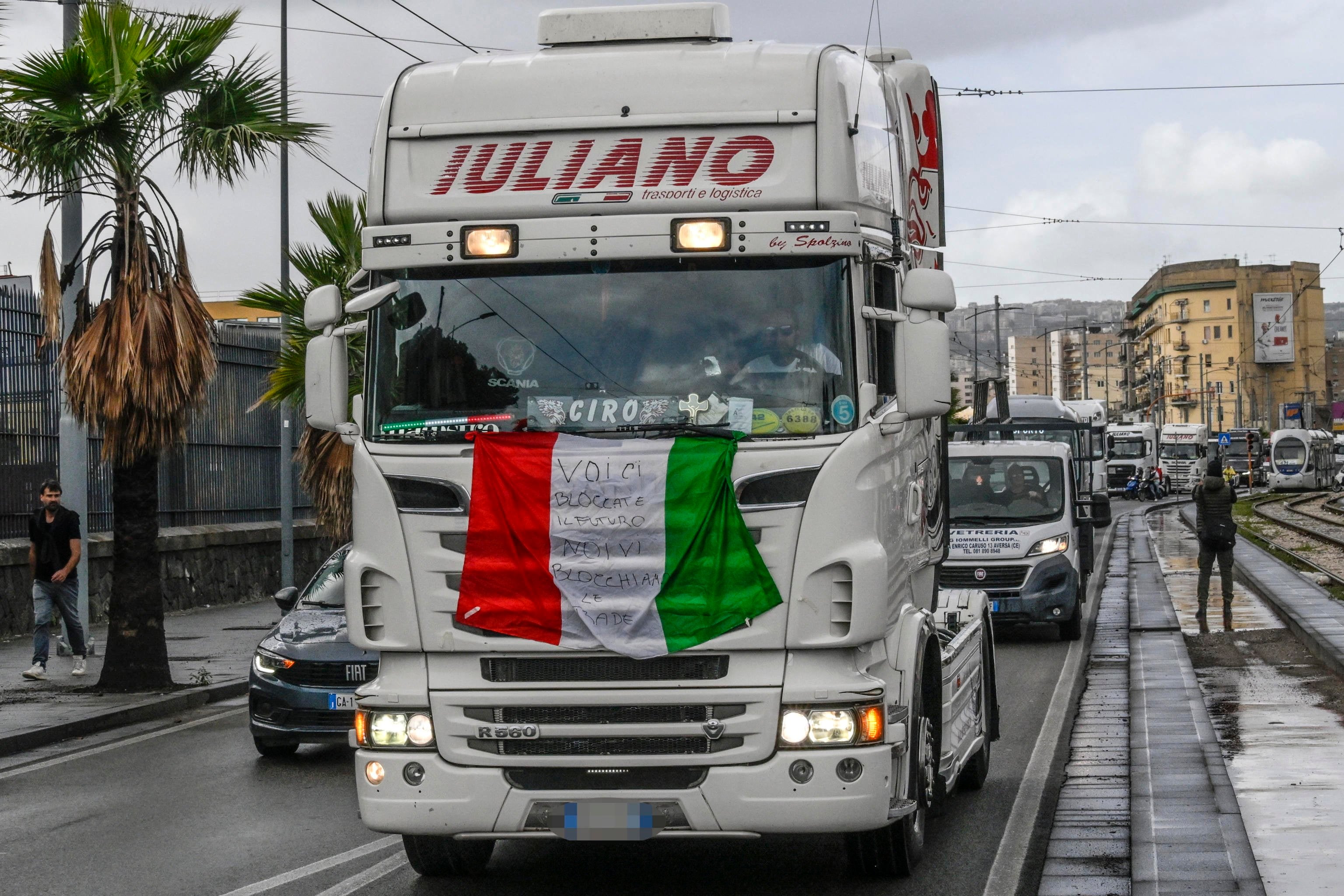 Truck drivers take part in a slow-moving protest in Naples, Italy, on Thursday. Photo: EPA