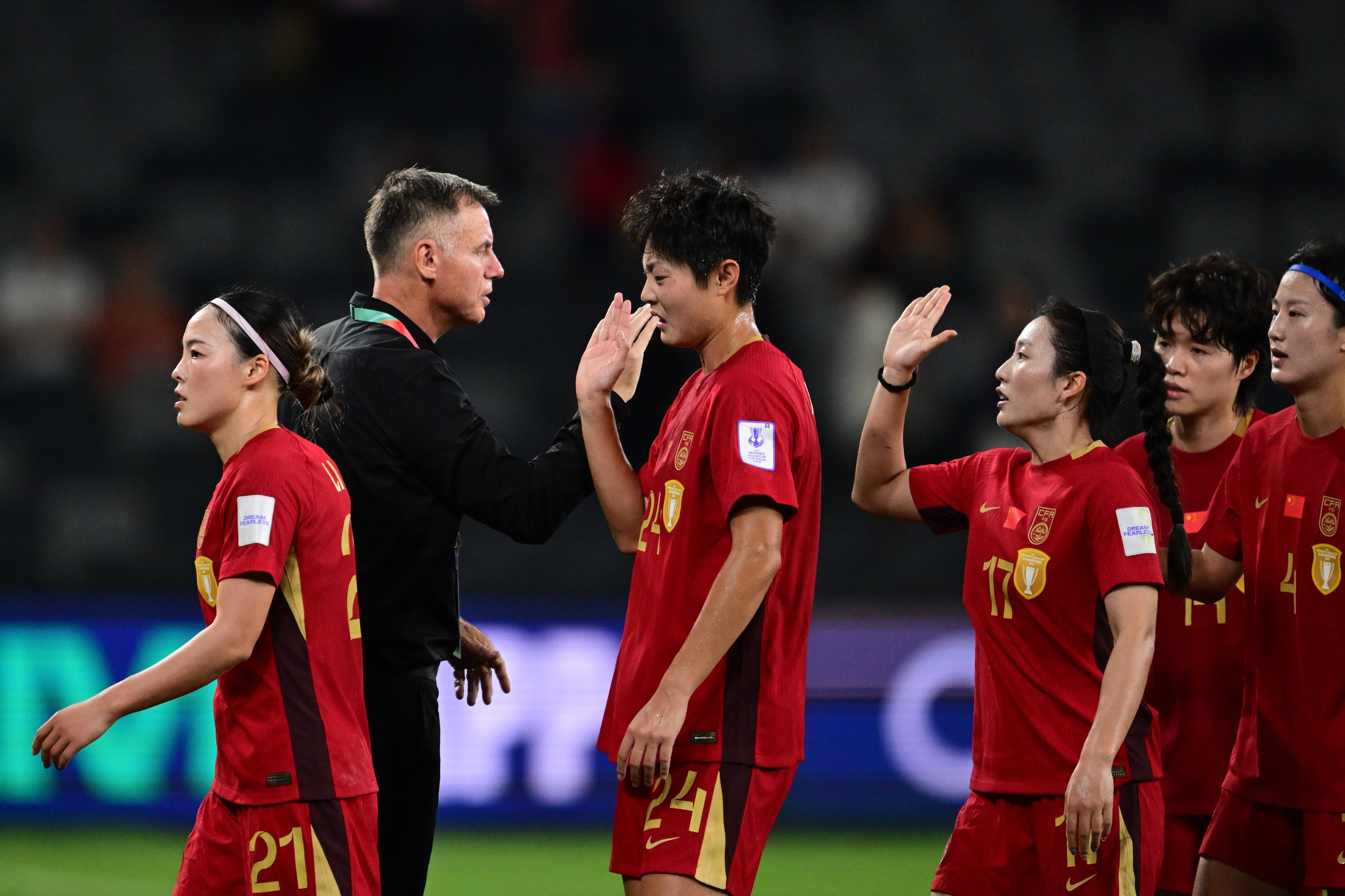 Ante Milicic high fives his China players after their 3-0 Asian Cup win over Uzbekistan in Sydney in March. China lost 2-1 to hosts Australia in the semi-finals but qualified for the World Cup. Photo: EPA