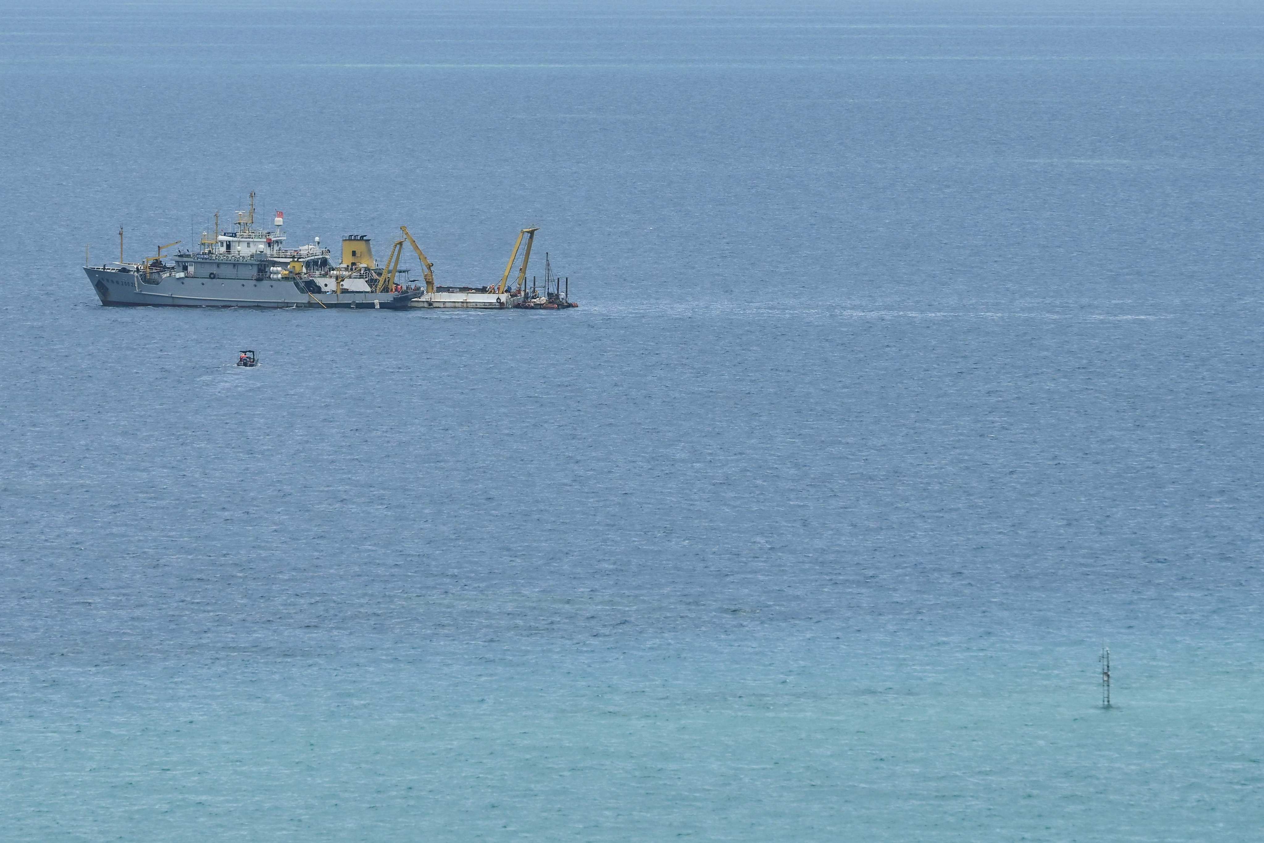 Ships identified by the Philippine coastguard as Chinese research vessels are seen at Scarborough Shoal in the disputed South China Sea on June 15. Photo: AFP