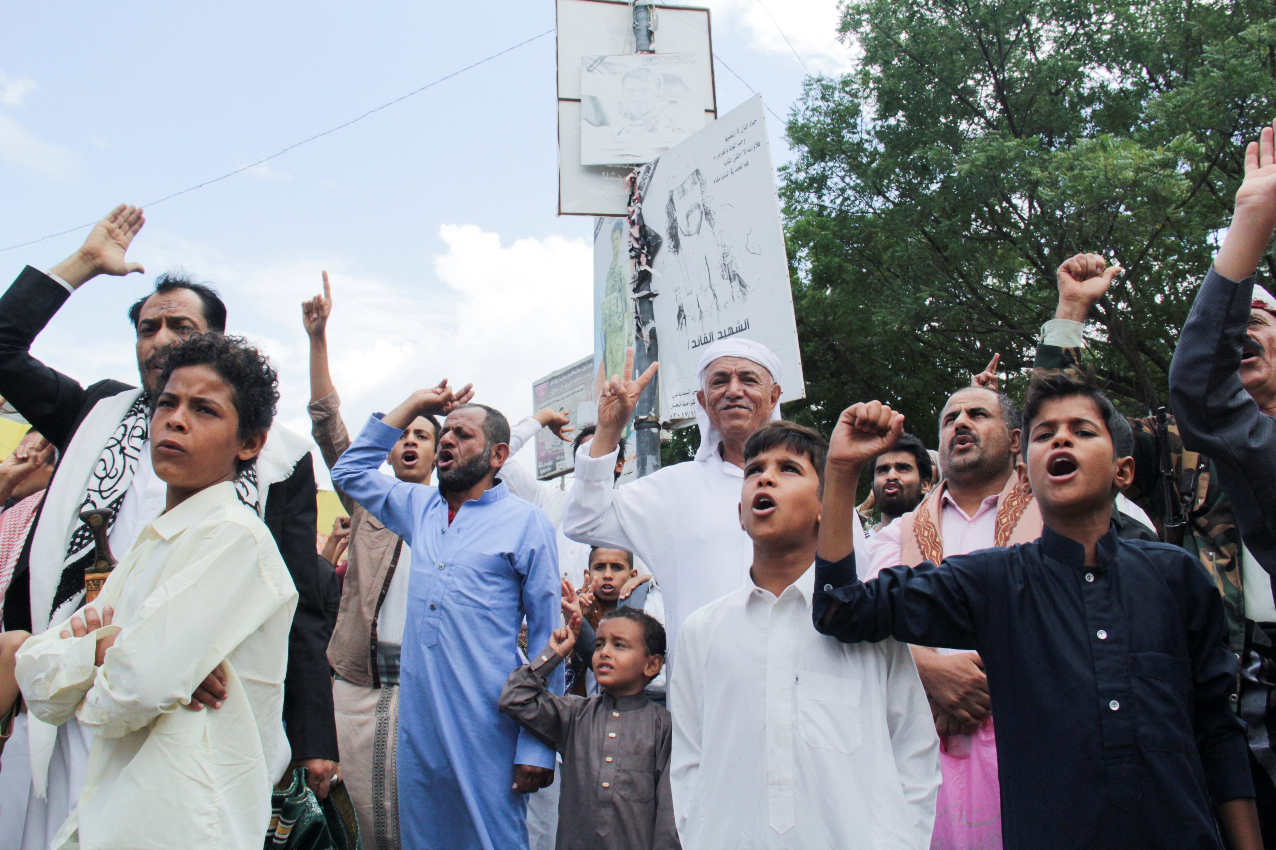 People chant slogans after they performed the Friday weekly prayer at the Freedom Square in the southwestern city of Taiz, Yemen on Friday. Photo: Reuters