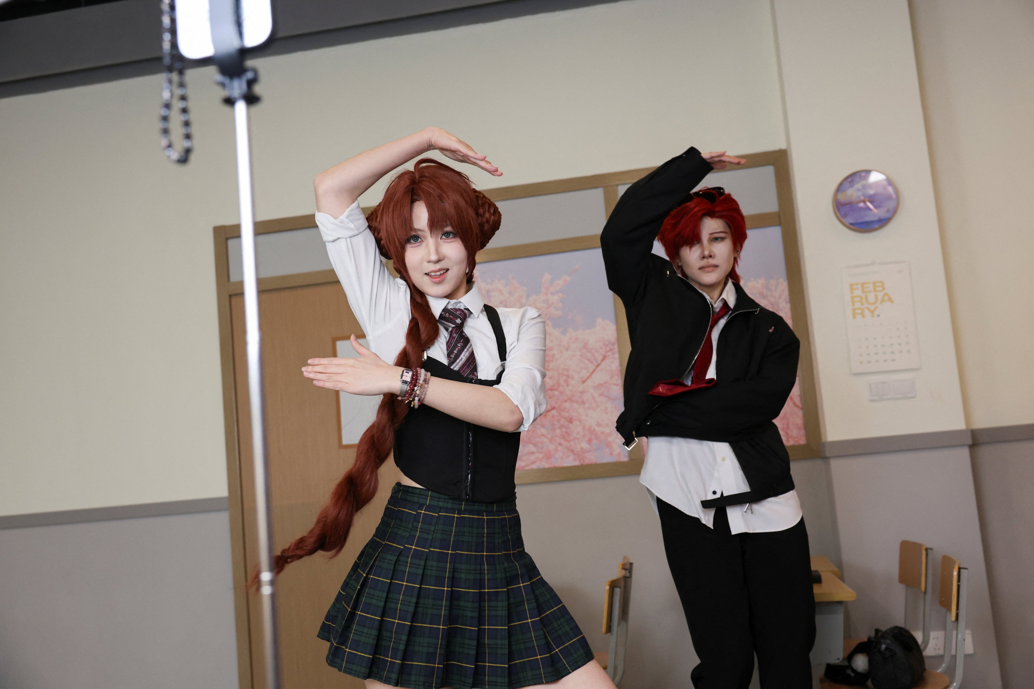 Visitors dance while wearing costumes at Chen Go, an “idol experience centre” where fans dress up as K-Pop idols, in Shanghai on April 5, 2025. Photo: Reuters