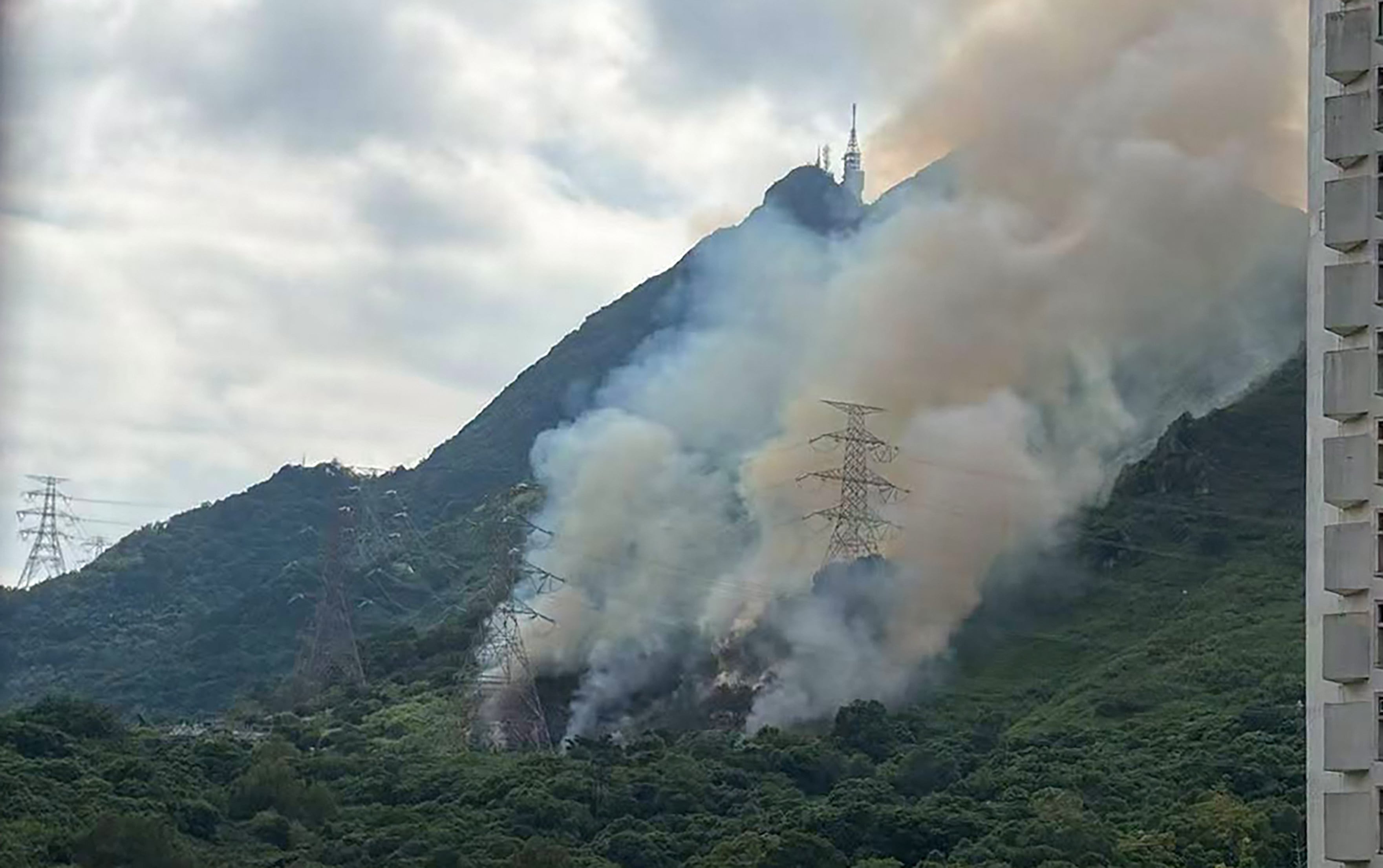 The blaze broke out in a patch of grass near a freshwater service reservoir off Wong Yin Street. Photo: Facebook/tuenmunlocals